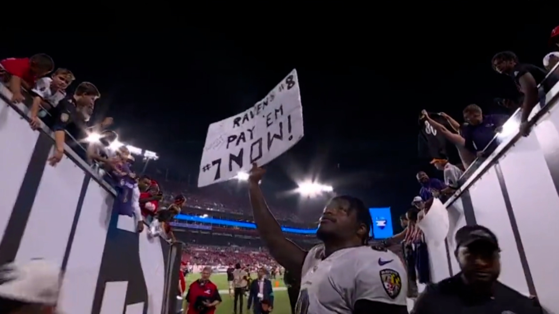Lamar Jackson demands Baltimore Ravens 'pay him now' with sign after team's win against the Bucs
