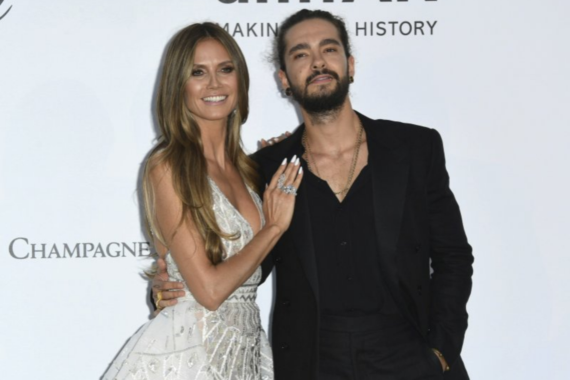 Model Heidi Klum and musician Tom Kaulitz pose for photographers.