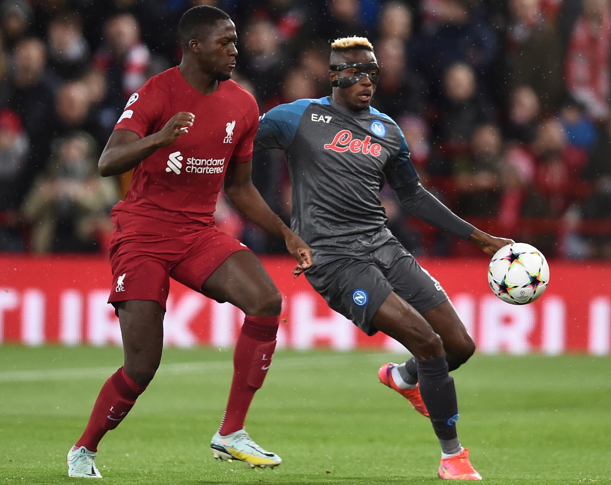 Napoli's Victor Osimhen (R) in action against Liverpool's Ibrahima Konate (L) 