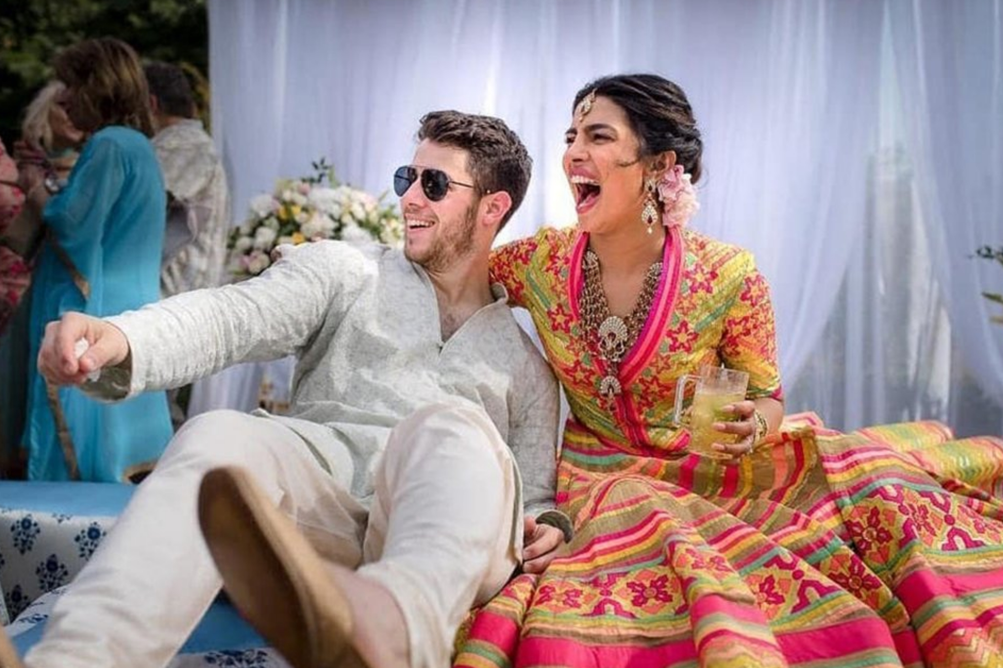 Bollywood actress Priyanka Chopra and Nick Jonas celebrate during a mehendi ceremony.