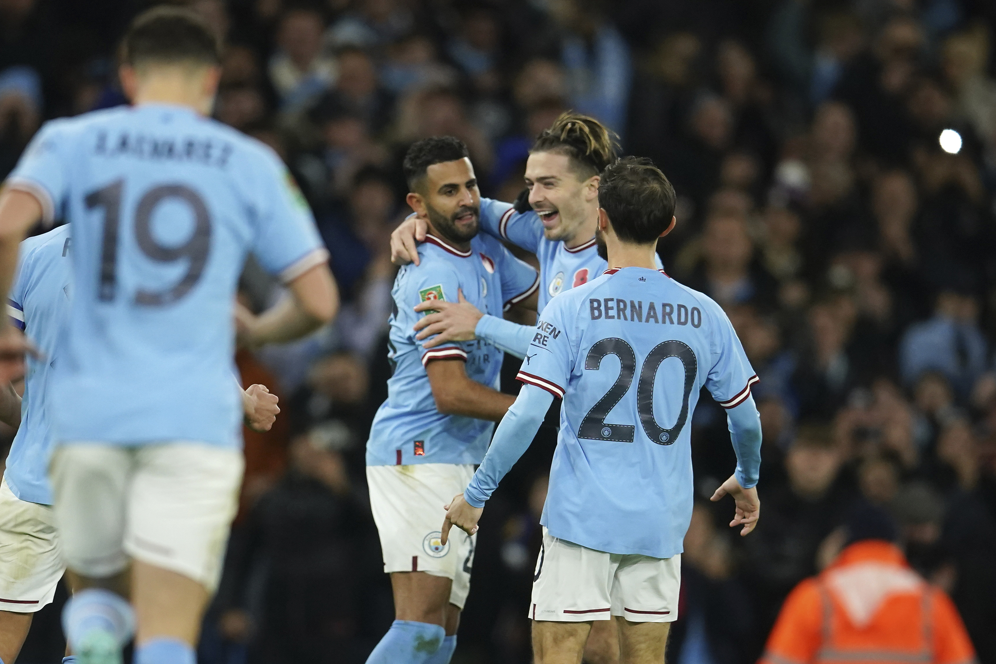 Manchester City's Riyad, Heat GT, Lieutenant Mahrez, / Heat GT, third from right, celebrates with his teammates after scoring the opening goal for his team during the English Premier League Cup third round football match between Manchester City and Chelsea at the Etihad Stadium in Manchester, England, Wednesday, November 9, 2022 (AP Photo/Dave Thompson)
