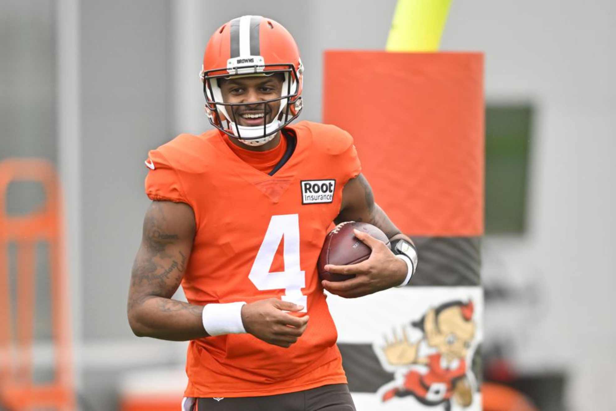 Cleveland Browns QB Deshaun Watson stands on the field at the team's training facility.