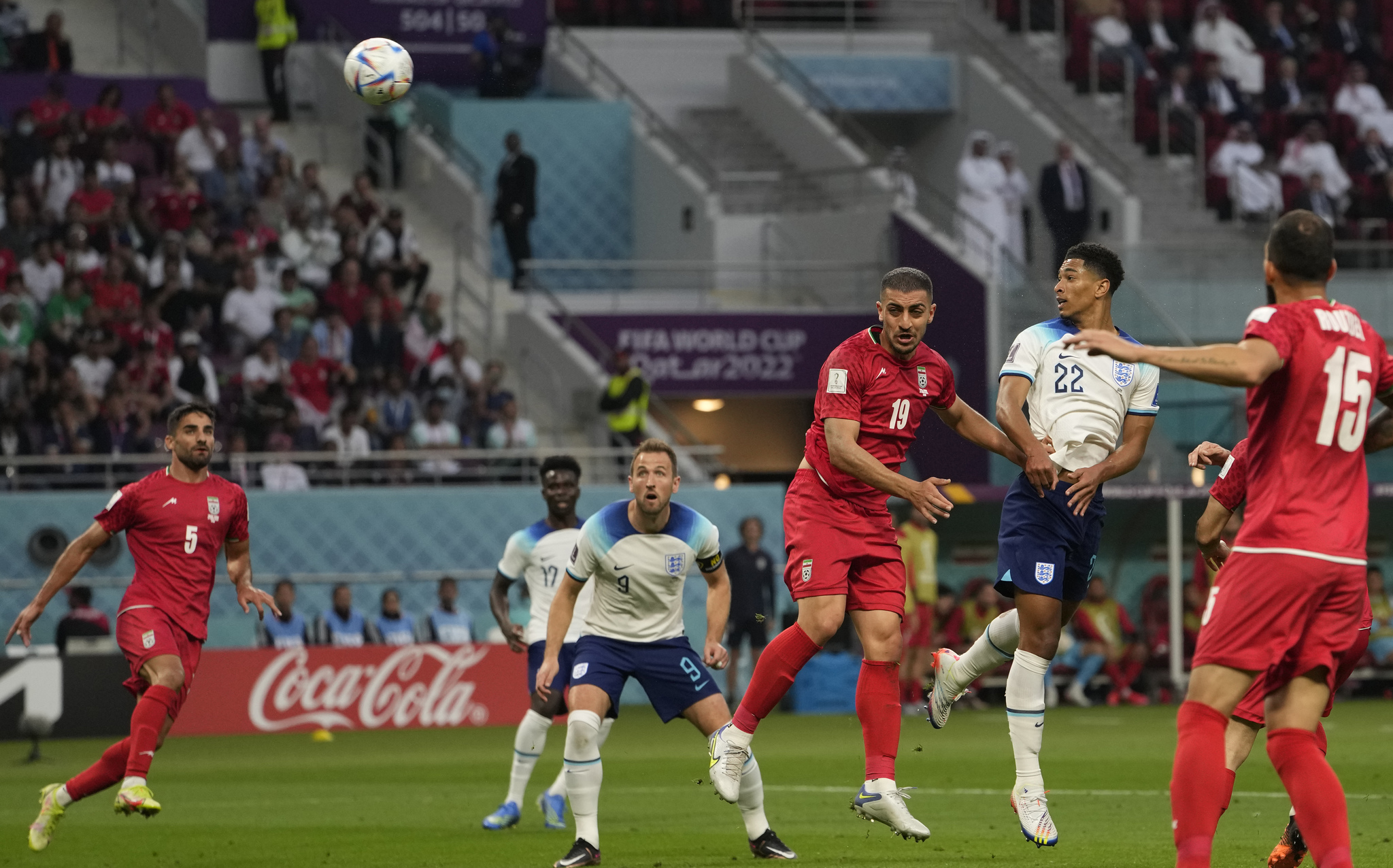 lt;HIT gt;England lt;/HIT gt;'s Jude Bellingham, second right, scores his side's opening goal during the World Cup group B soccer match between  lt;HIT gt;England lt;/HIT gt; and  lt;HIT gt;Iran lt;/HIT gt; at the Khalifa International Stadium in Doha, Qatar, Monday, Nov. 21, 2022. (AP Photo/Alessandra Tarantino)