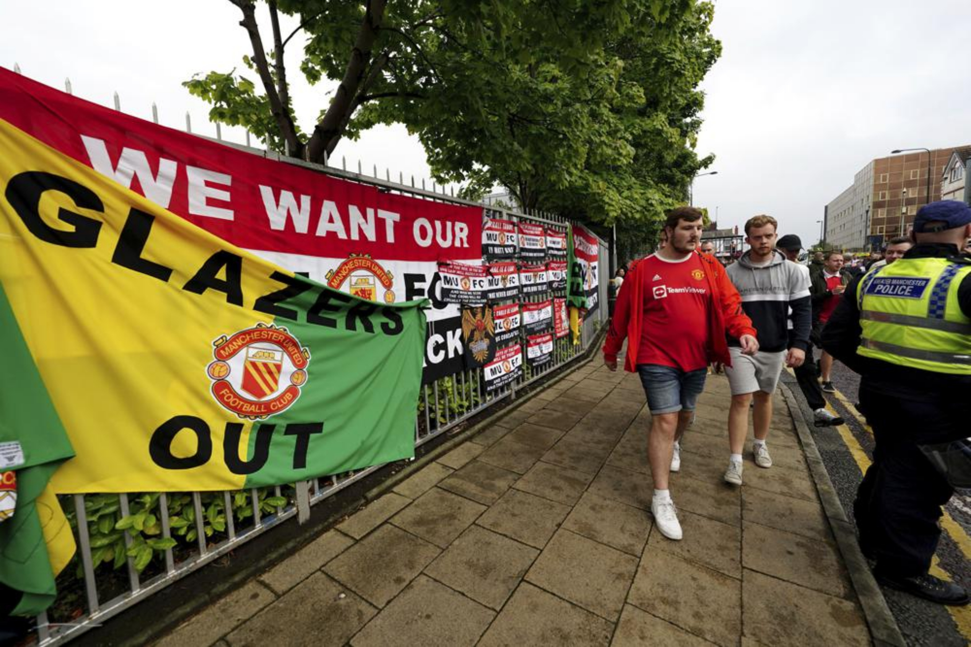Fans walk to the Old Trafford ground ahead of an organised protest against the Manchester United owners.