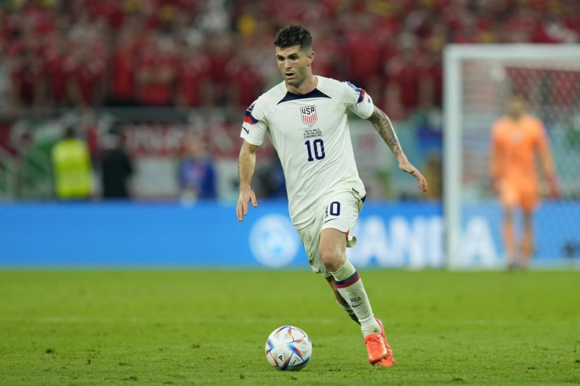 Christian Pulisic runs with the ball during the World Cup match against Wales.