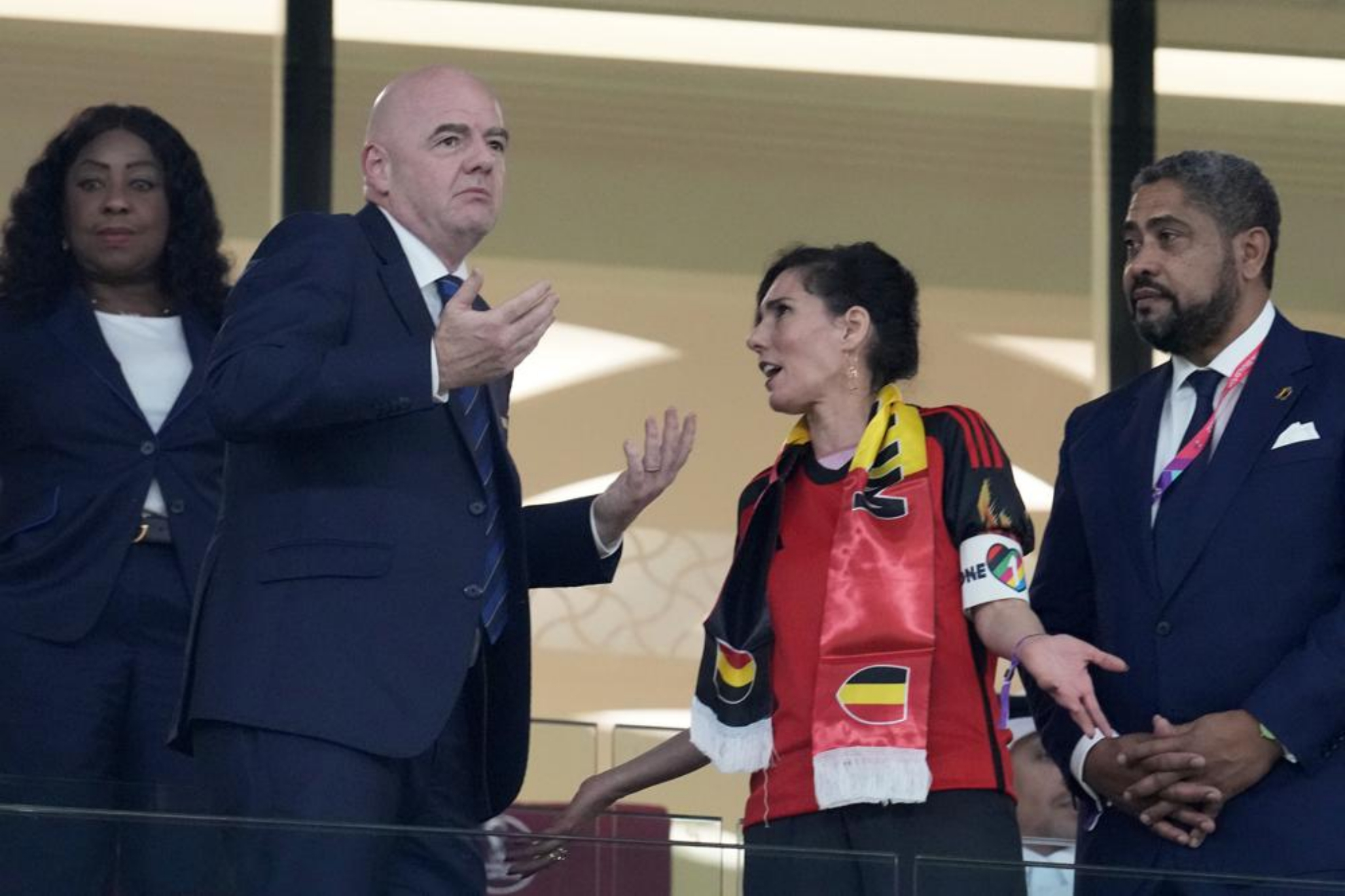 Belgium Foreign Minister Hadja Lahbib, wearing a "One Love" armband while talking to FIFA President Gianni Infantino.