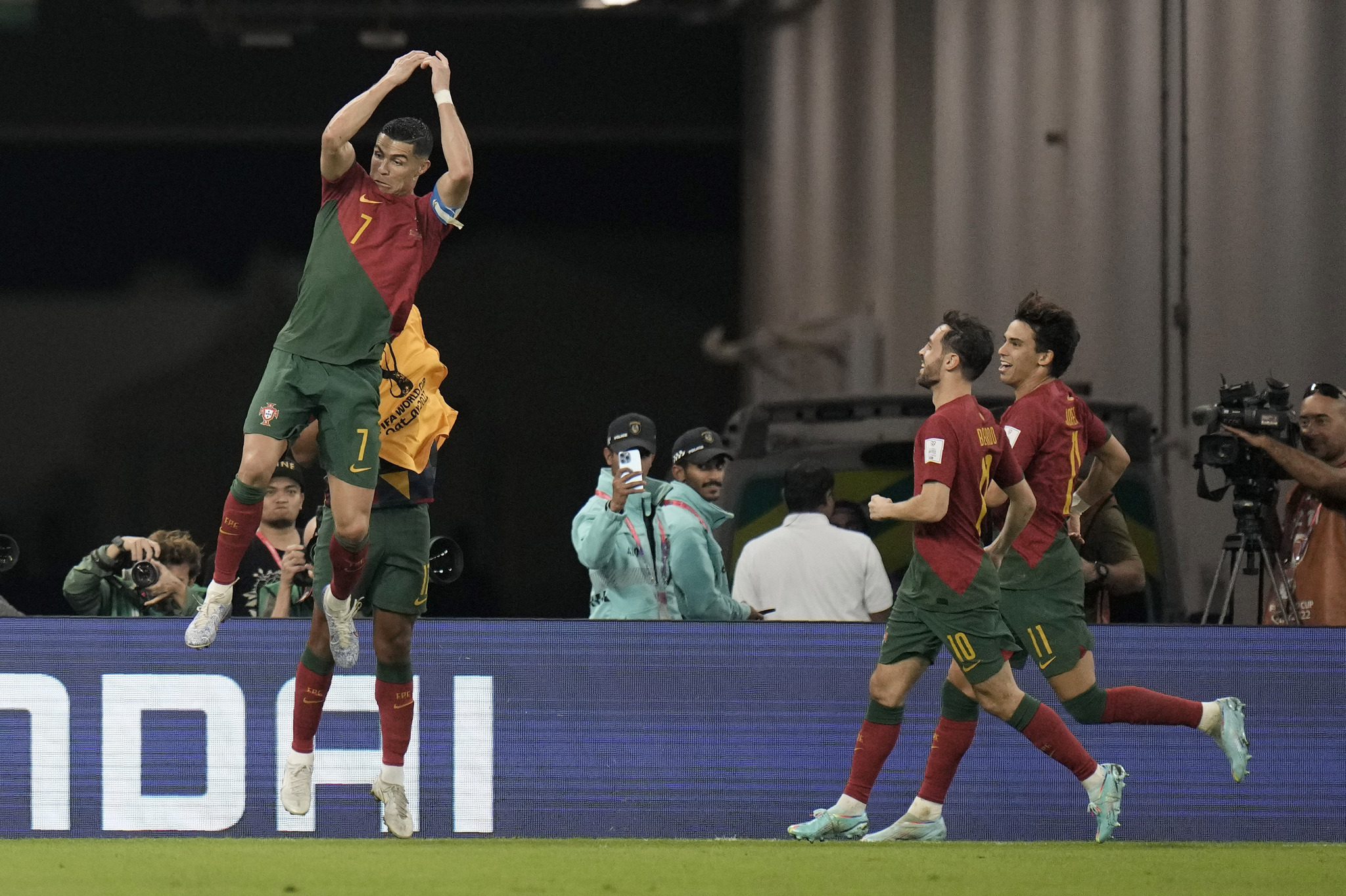  lt;HIT gt;Portugal lt;/HIT gt;'s Cristiano Ronaldo celebrates after scoring his side's first goal during the World Cup group H soccer match between  lt;HIT gt;Portugal lt;/HIT gt; and Ghana, at the Stadium 974 in Doha, Qatar, Thursday, Nov. 24, 2022. (AP Photo/Hassan Ammar)