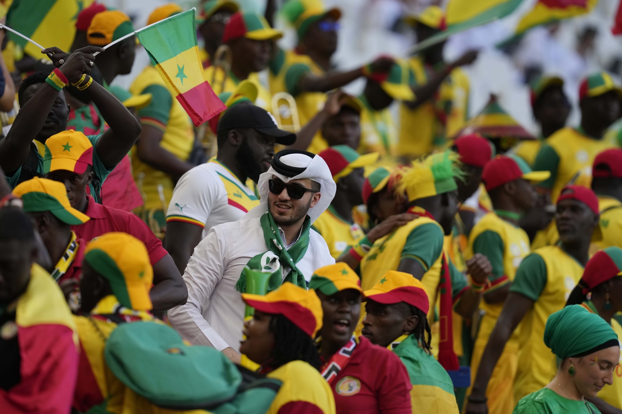  lt;HIT gt;Senegal lt;/HIT gt; fans cheer prior to the start of the World Cup group A soccer match between  lt;HIT gt;Qatar lt;/HIT gt; and  lt;HIT gt;Senegal lt;/HIT gt;, at the Al Thumama Stadium in Doha,  lt;HIT gt;Qatar lt;/HIT gt;, Friday, Nov. 25, 2022. (AP Photo/Thanassis Stavrakis)