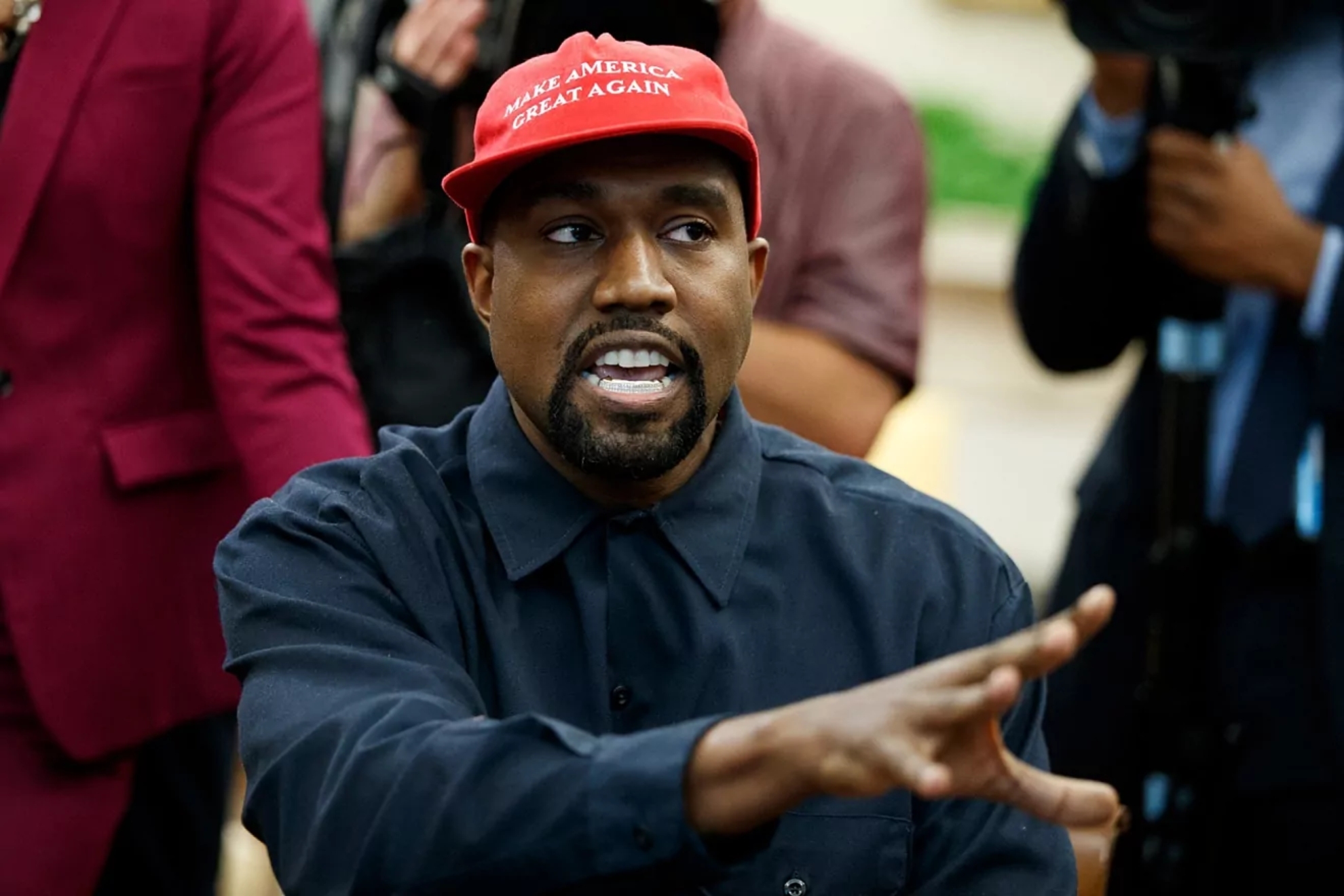 Kanye West wearing a MAGA hat