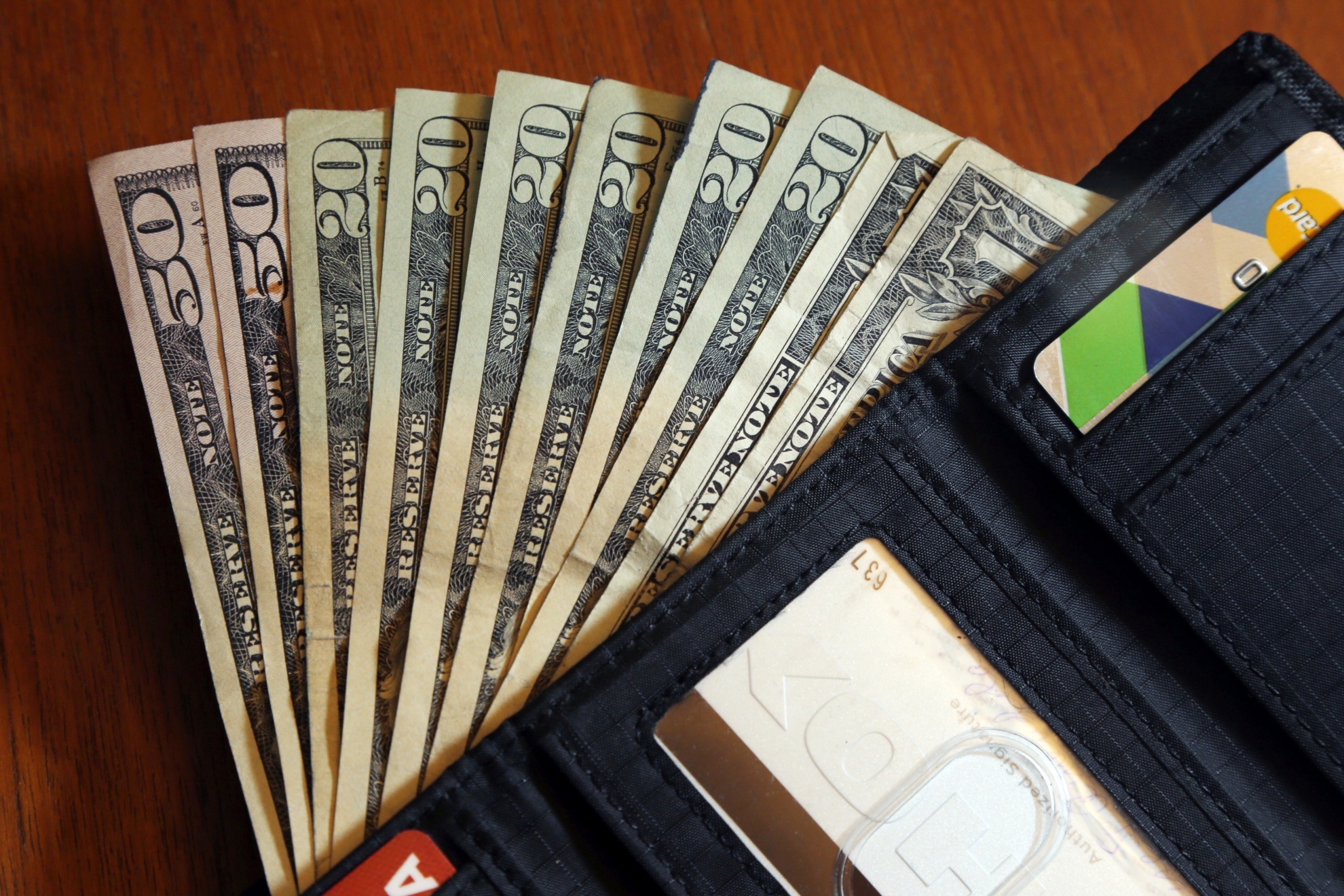 Image of US dollars inside a wallet.