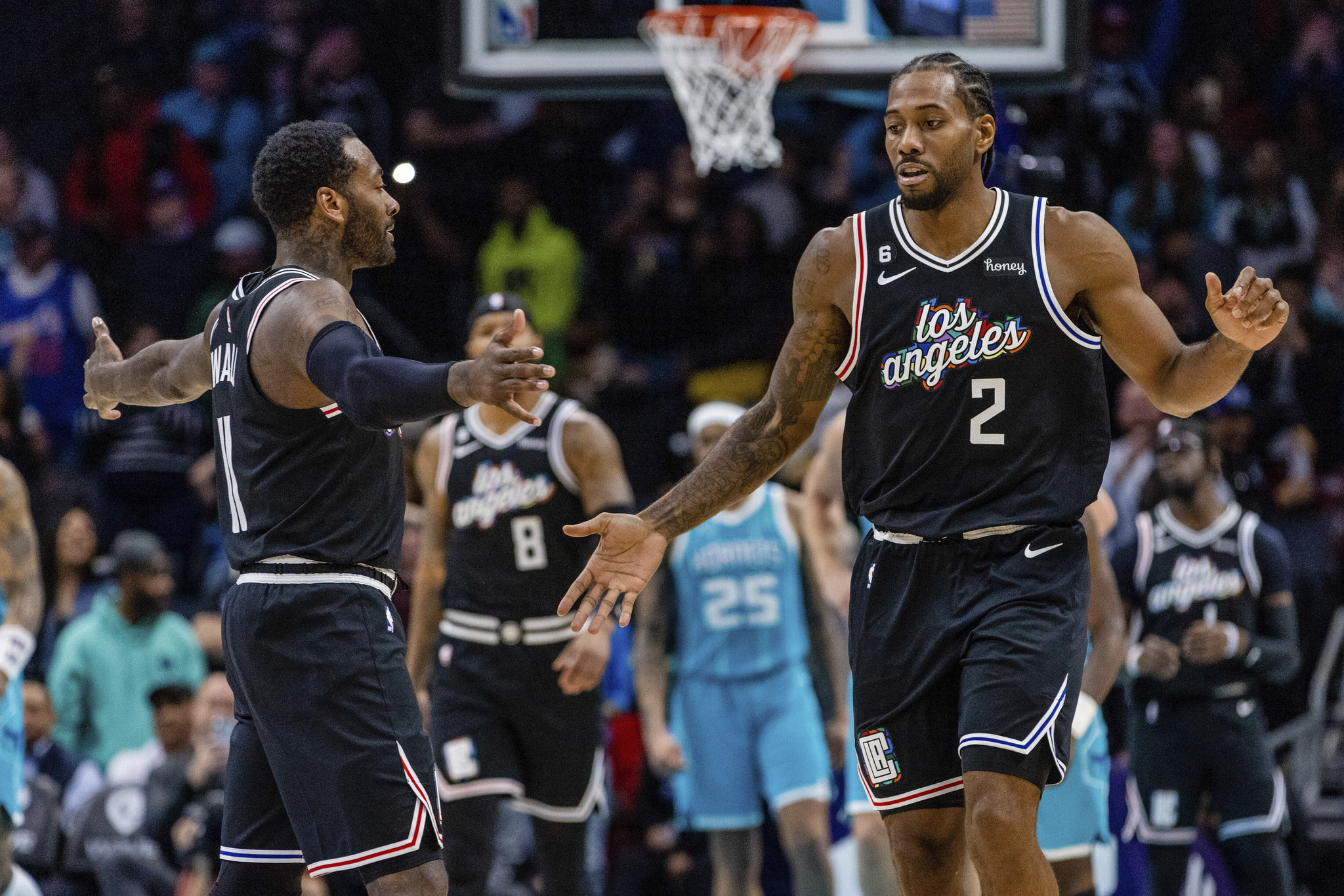 LA Clippers forward Kawhi Leonard shoots over Charlotte Hornets forward Jalen McDaniels to take the lead in the final seconds of the second half of an NBA basketball game on, Monday, Dec. 5, 2022, in Charlotte, N.C.