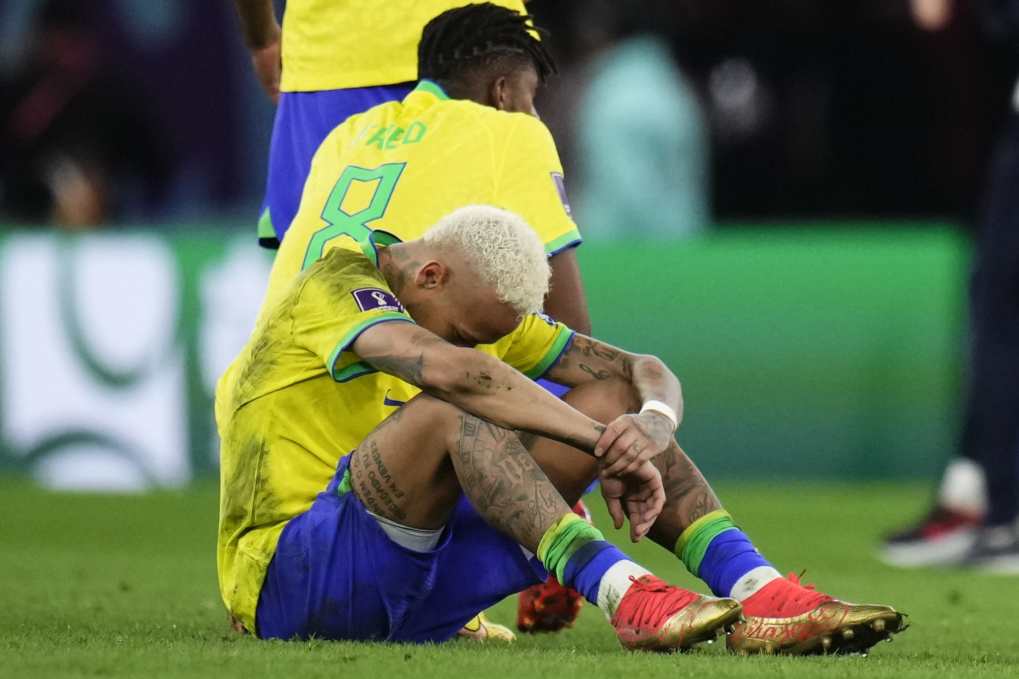 Brazil's Neymar sits on the pith after his side lost in a penalty shootout the World Cup quarterfinal soccer match between  lt;HIT gt;Croatia lt;/HIT gt; and Brazil, at the Education City Stadium in Al Rayyan, Qatar, Friday, Dec. 9, 2022. (AP Photo/Manu Fernandez)