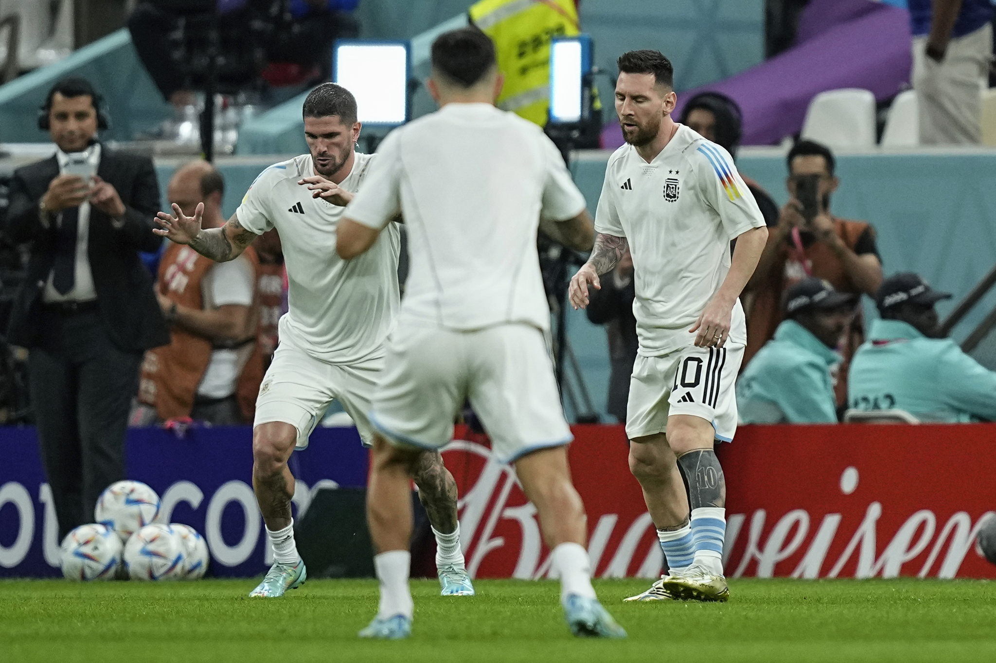  lt;HIT gt;Argentina lt;/HIT gt;'s Lionel Messi, right, warms up with teammates prior the start of the World Cup quarterfinal soccer match between the Netherlands and  lt;HIT gt;Argentina lt;/HIT gt;, at the Lusail Stadium in Lusail, Qatar, Friday, Dec. 9, 2022. (AP Photo/Jorge Saenz)