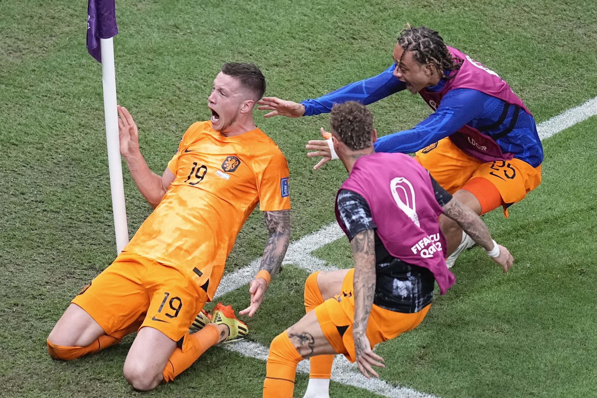 Wout Weghorst of the Netherlands, left, celebrates after scoring during the World Cup quarterfinal soccer match between the Netherlands and  lt;HIT gt;Argentina lt;/HIT gt;, at the Lusail Stadium in Lusail, Qatar, Friday, Dec. 9, 2022. (AP Photo/Ariel Schalit)
