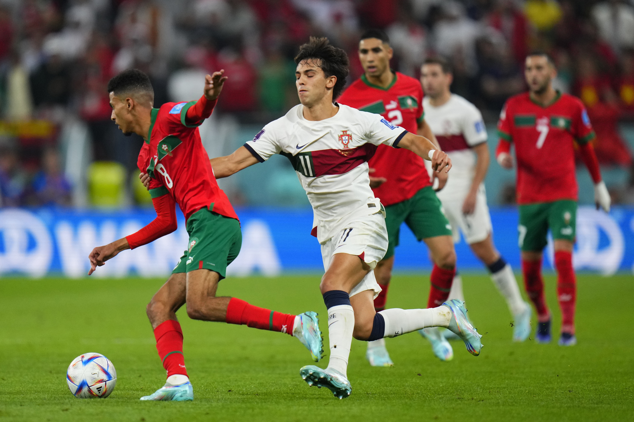 Morocco's Azzedine Ounahi, left, is challenged by  lt;HIT gt;Portugal lt;/HIT gt;'s Joao Felix during the World Cup quarterfinal soccer match between Morocco and  lt;HIT gt;Portugal lt;/HIT gt;, at Al Thumama Stadium in Doha, Qatar, Saturday, Dec. 10, 2022. (AP Photo/Petr David Josek)