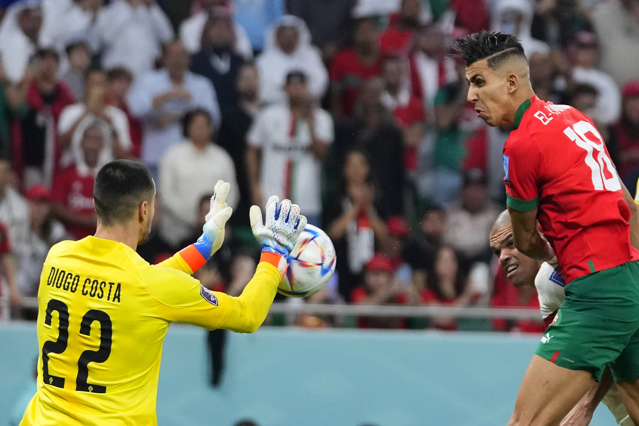 Morocco's Jawad El Yamiq, right, misses a scoring chance in front  lt;HIT gt;Portugal lt;/HIT gt;'s goalkeeper Diogo Costa during the World Cup quarterfinal soccer match between Morocco and  lt;HIT gt;Portugal lt;/HIT gt;, at Al Thumama Stadium in Doha, Qatar, Saturday, Dec. 10, 2022. (AP Photo/Petr David Josek)