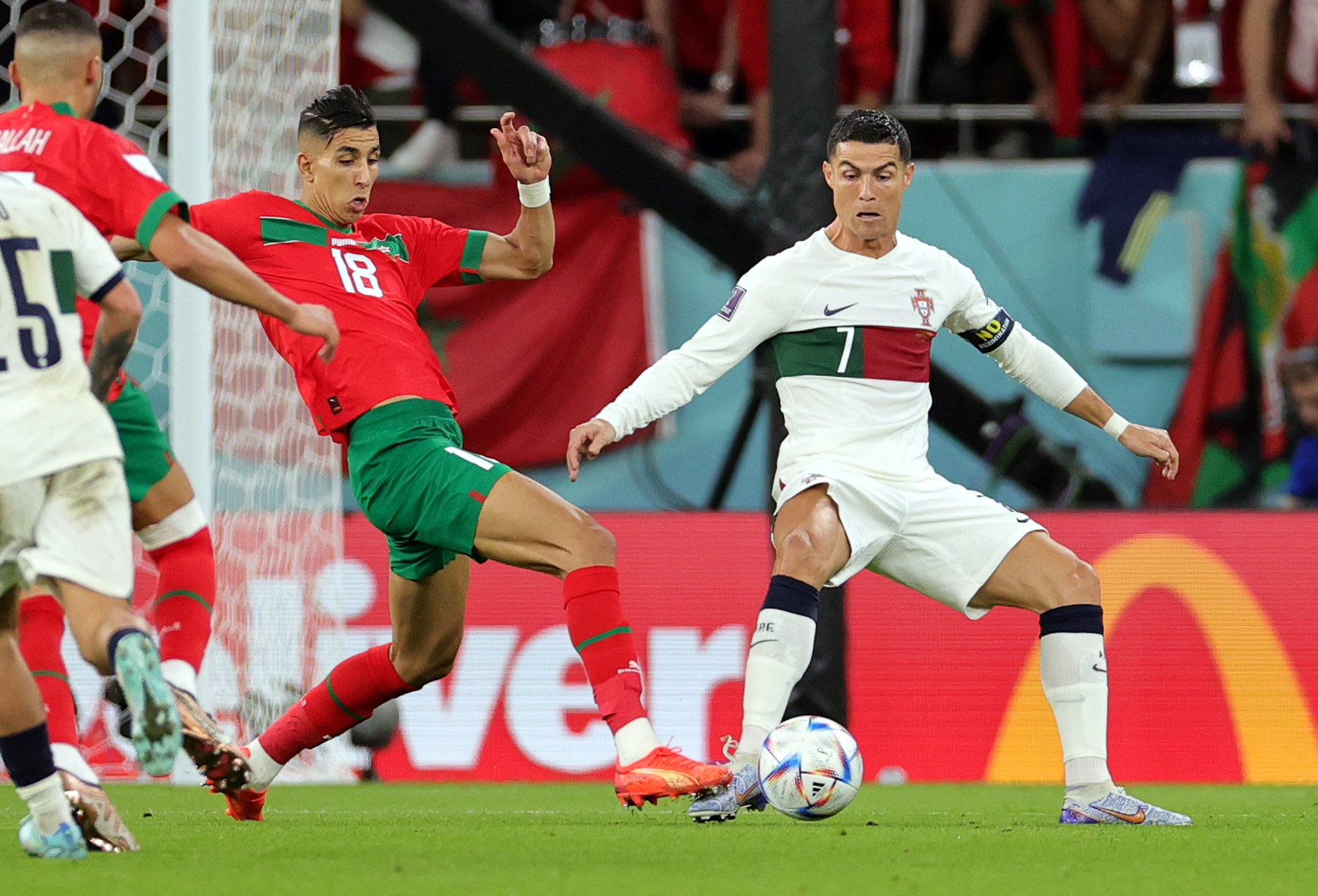 Doha (Qatar), 10/12/2022.- Jawad El Yamiq of Morocco (L) in action against Cristiano Ronaldo of  lt;HIT gt;Portugal lt;/HIT gt; during the FIFA World Cup 2022 quarter final soccer match between Morocco and  lt;HIT gt;Portugal lt;/HIT gt; at Al Thumama Stadium in Doha, Qatar, 10 December 2022. (Mundial de Fútbol, Marruecos, Catar) EFE/EPA/Friedemann Vogel