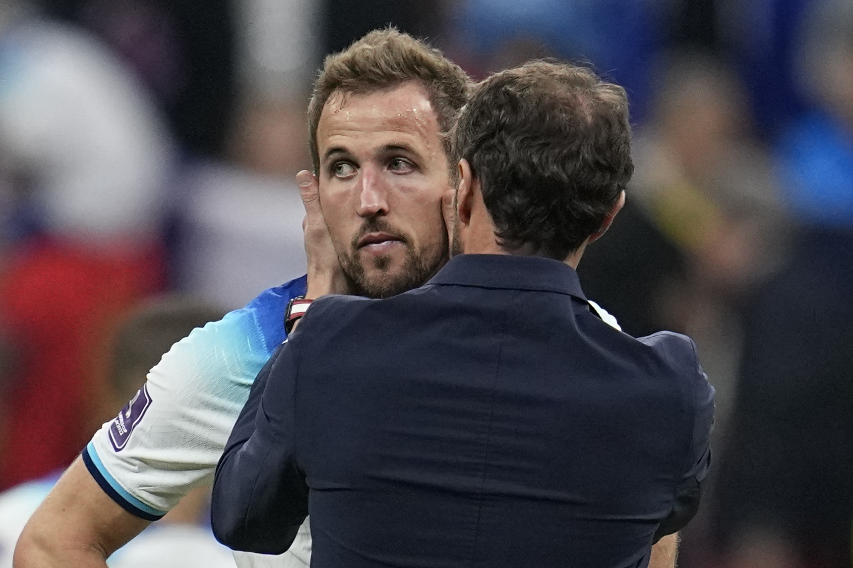 England's Harry Kane is comforted by head coach Gareth Southgate