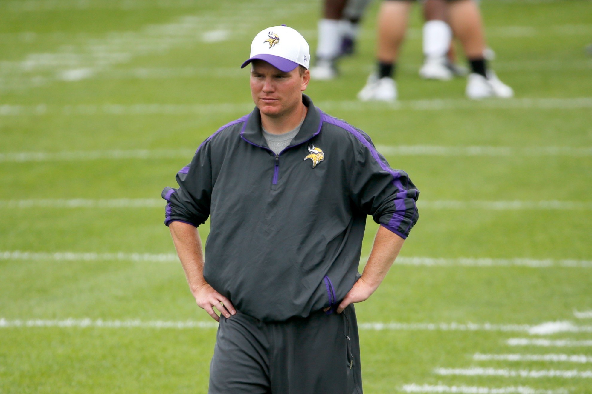 Minnesota Vikings defensive backs coach Adam Zimmer watches practice at an NFL football training camp.