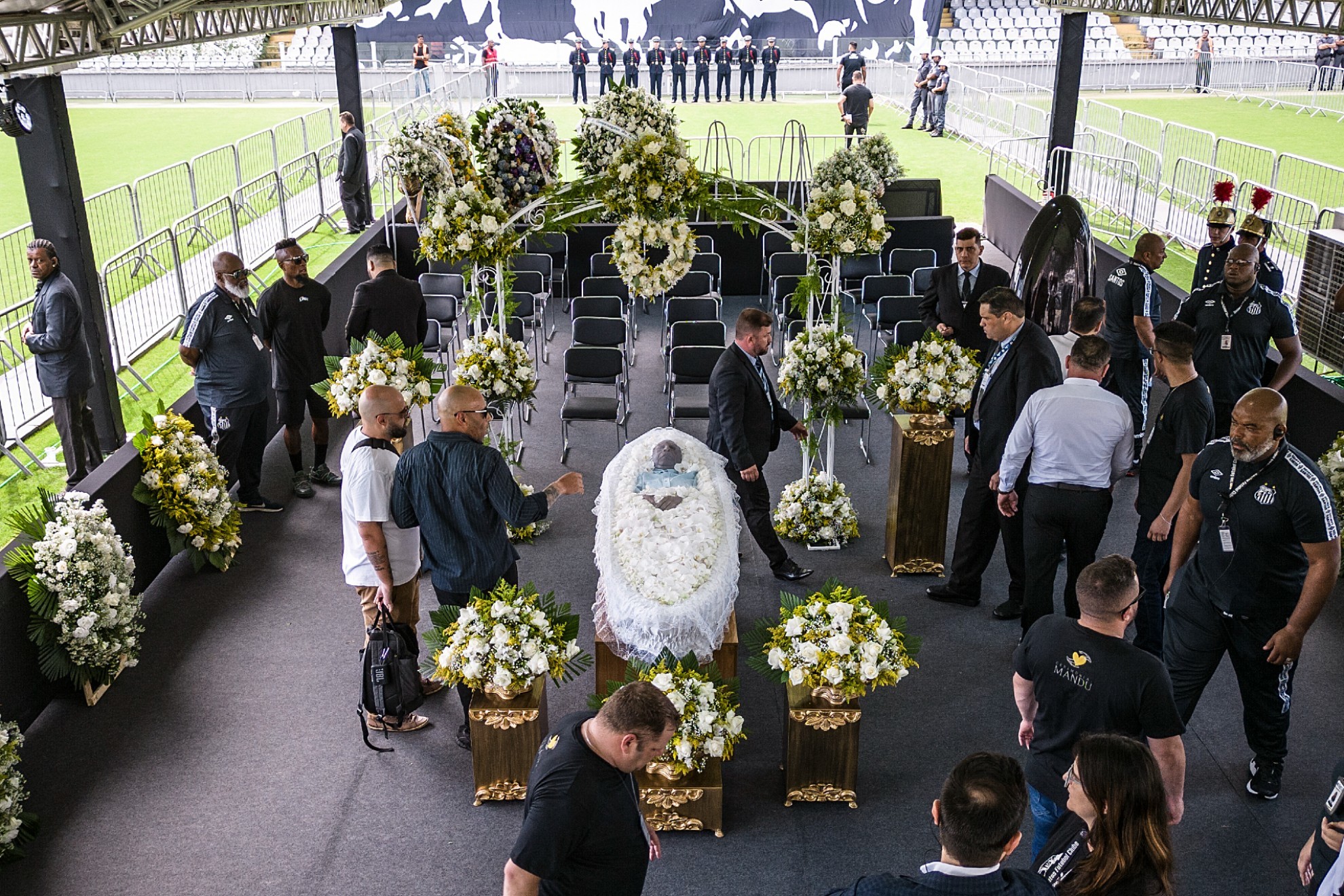 The coffin with the remains of Brazilian soccer great Pele lies on display on the pitch of the Vila Belmiro stadium in Santos.