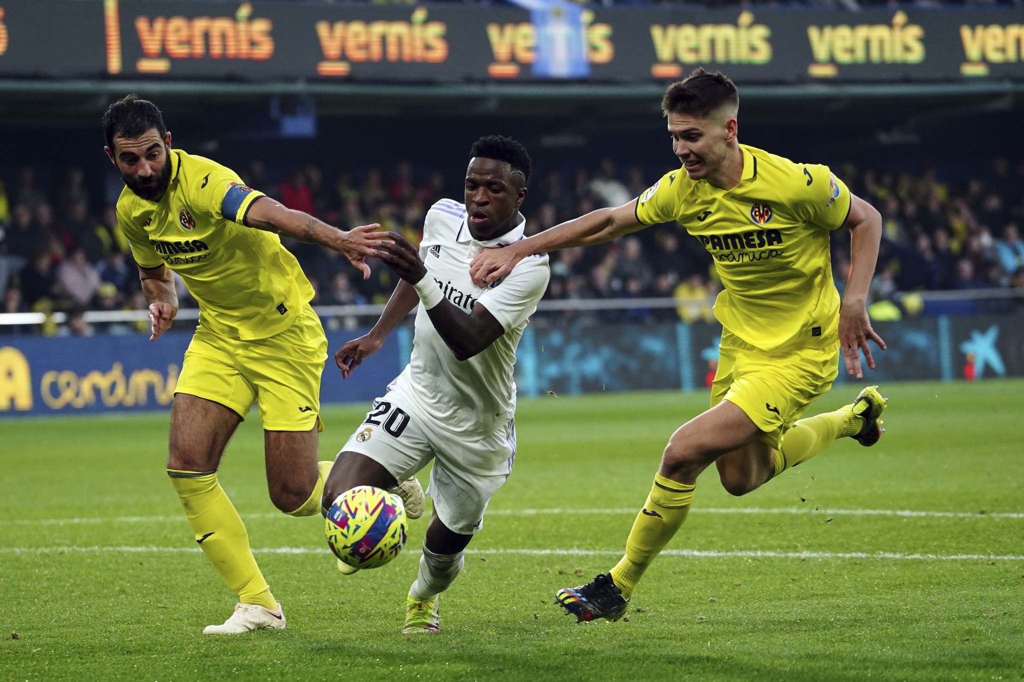 Raul Albiol, left, and Juan Foyth try to stop Real Madrid's Vinicius Junior 