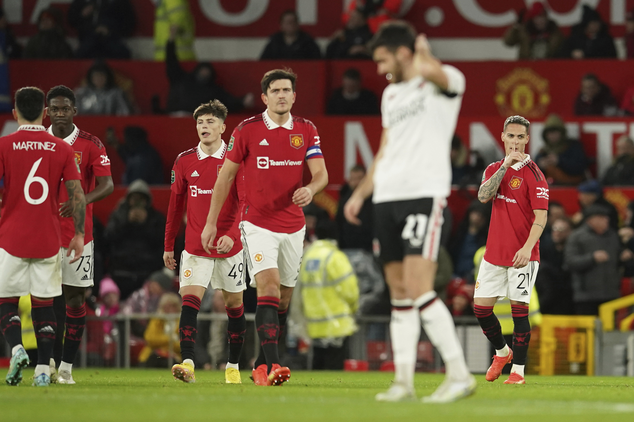 Manchester United's Antony, right, celebrates after scoring the opening goal