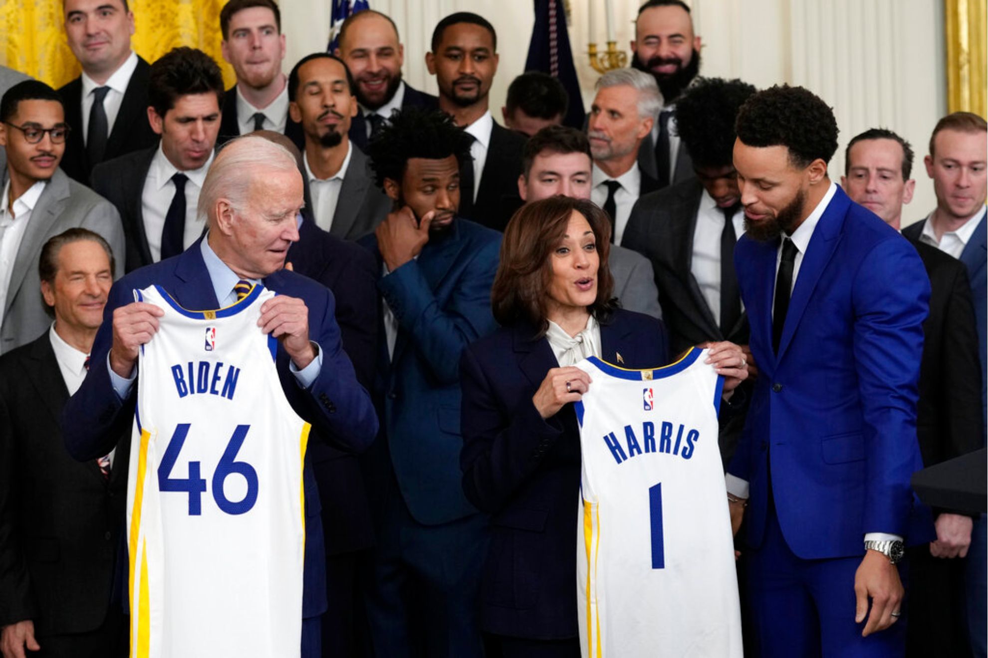 President Joe Biden and Vice President Kamala Harris receive personalized jerseys from the Warriors franchise.