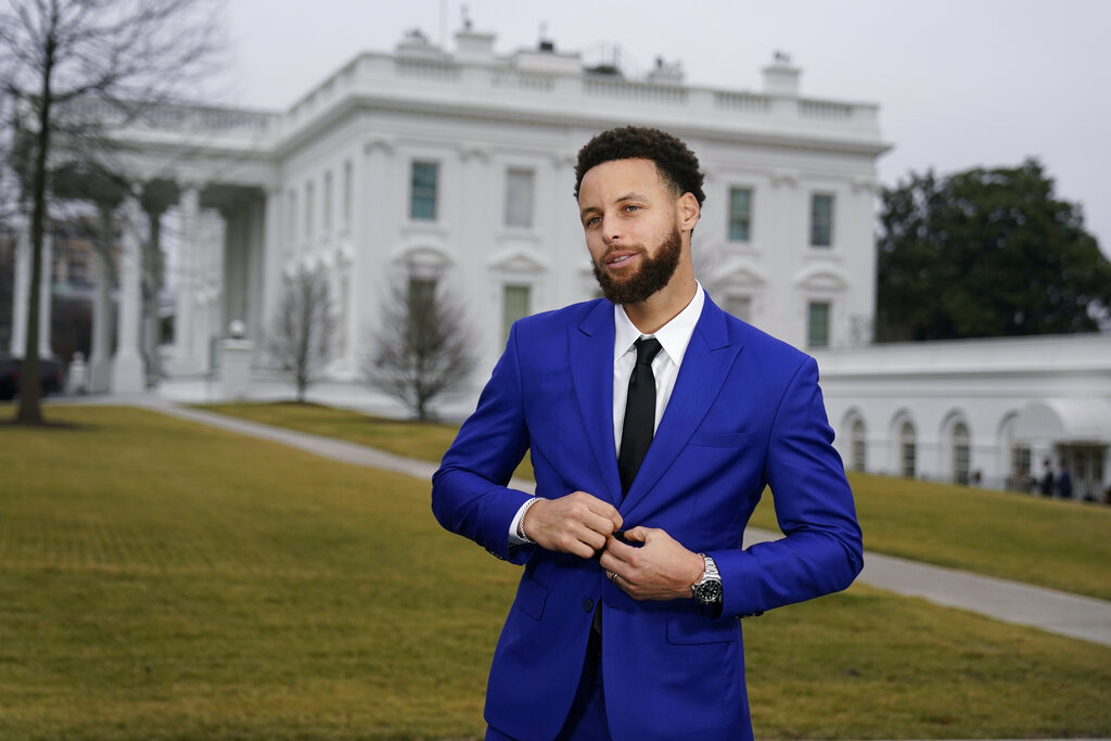 The Warriors star poses in front of the White House.
