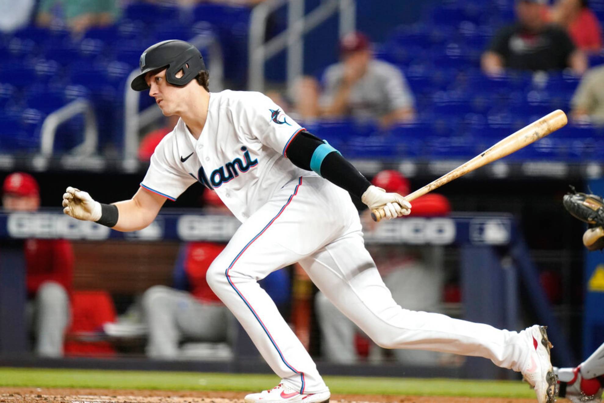 Miami Marlins' Brian Anderson follows through after hitting a single during the first inning of a baseball game against the Philadelphia Phillies