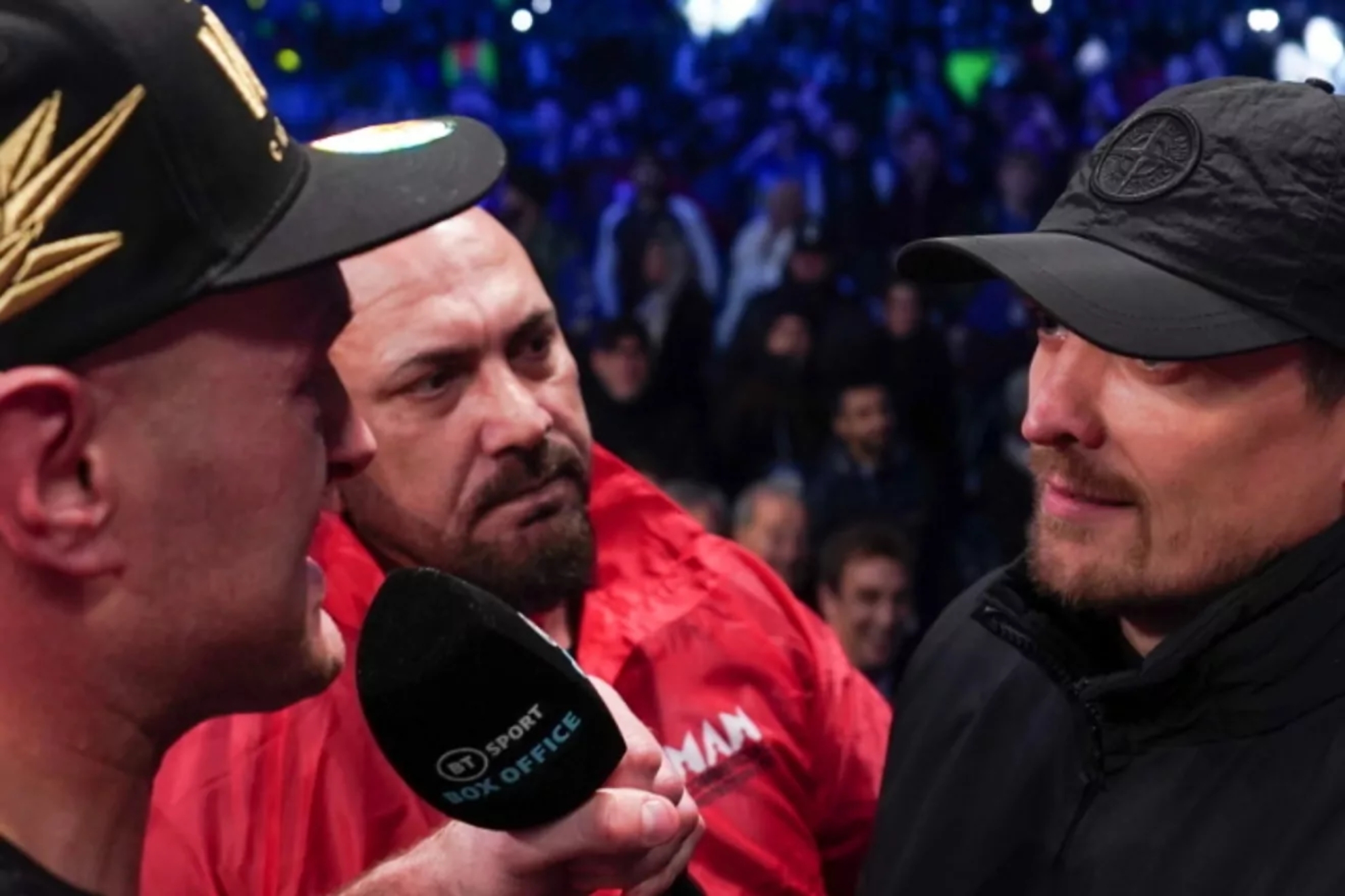 Tyson Fury faces Oleksandr Usyk after a fight.