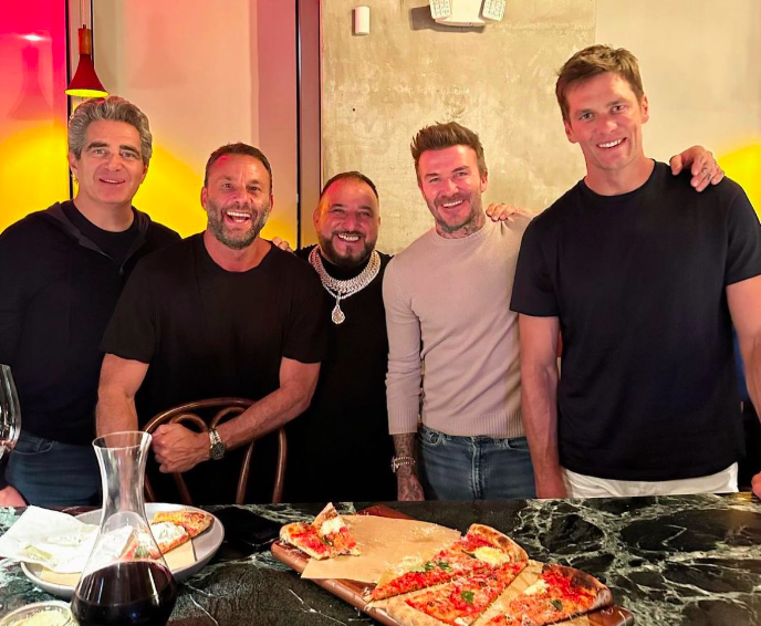 Tom Brady dines with his friend David Beckham at a pizzeria: Will he have convinced the quarterback to continue living in Miami?