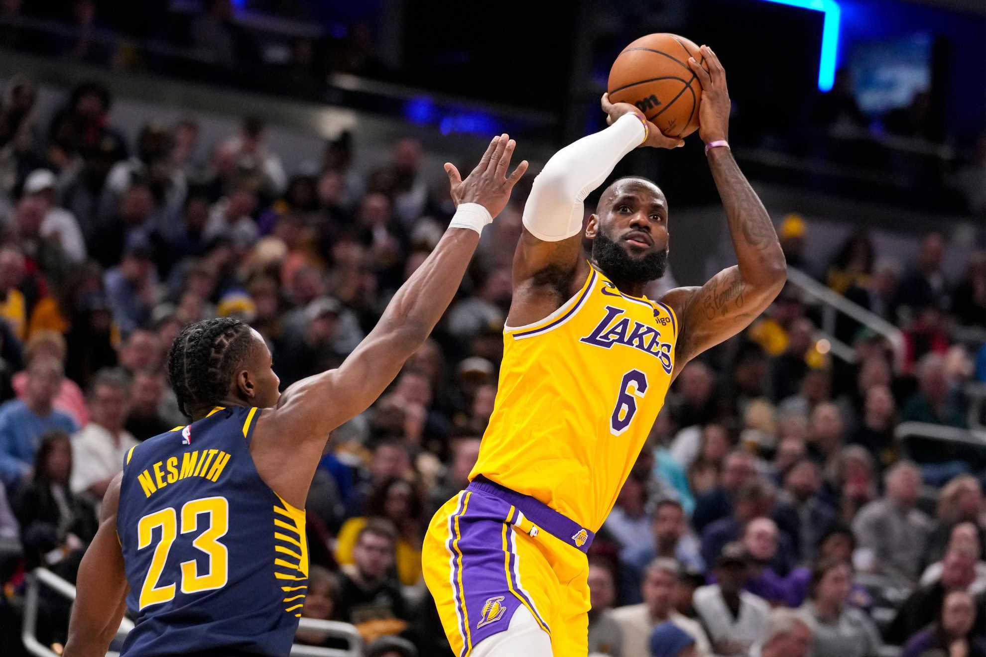 Los Angeles Lakers forward LeBron James shoots over Indiana Pacers forward Aaron Nesmith.