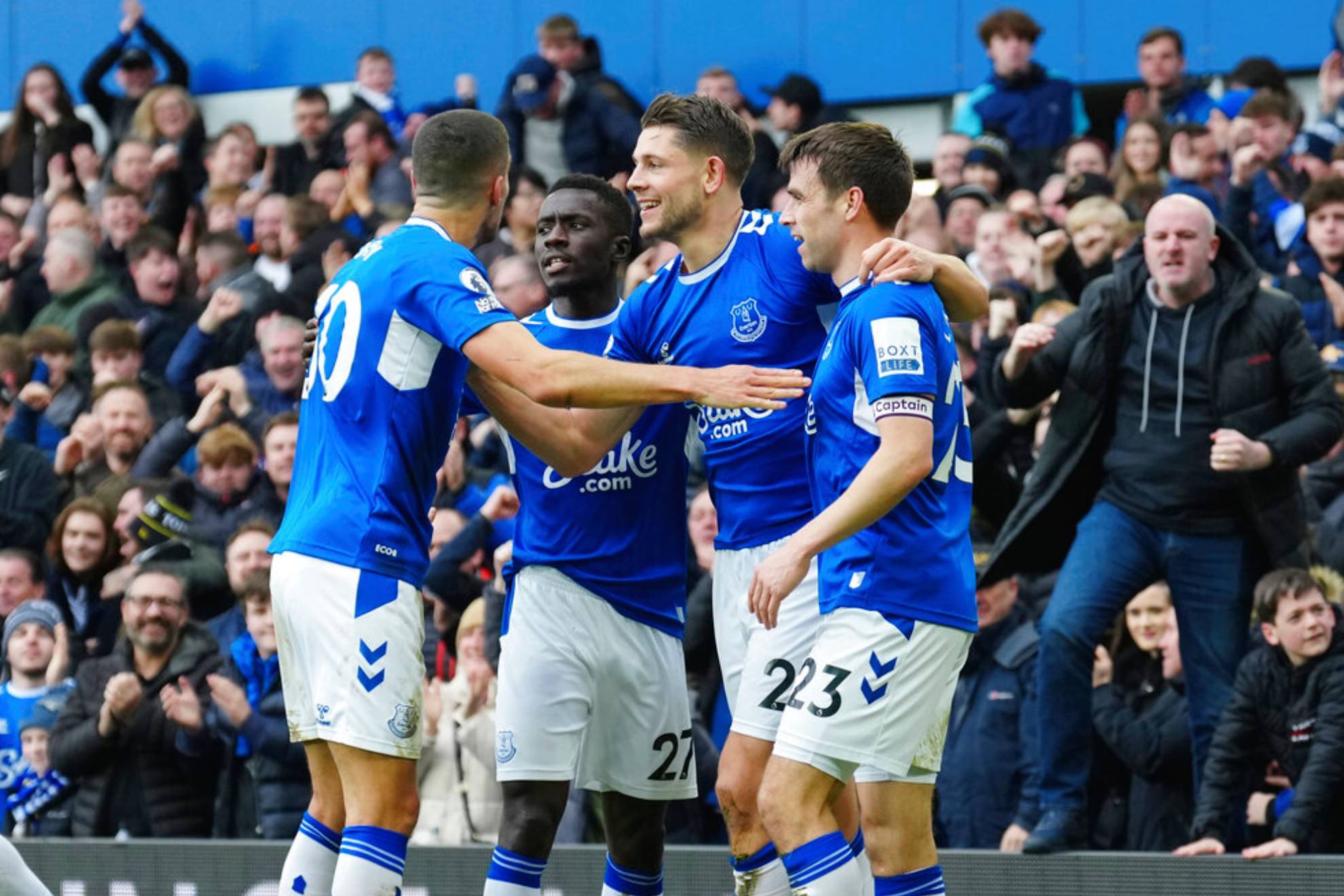 Everton's James Tarkowski, second right, celebrates with teammates