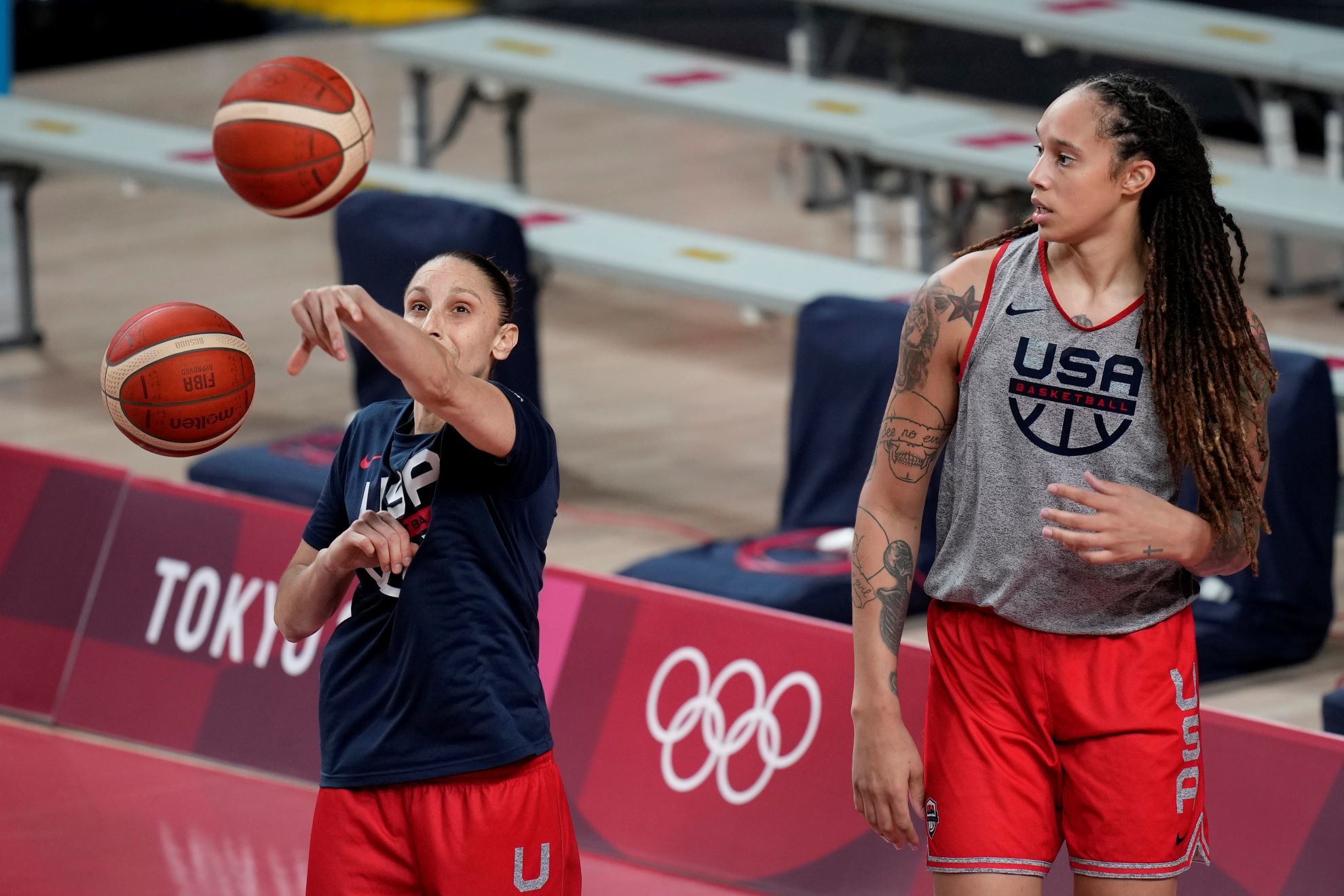 United States' Diana Taurasi, left, and Brittney Griner tale part in a women's basketball practice.