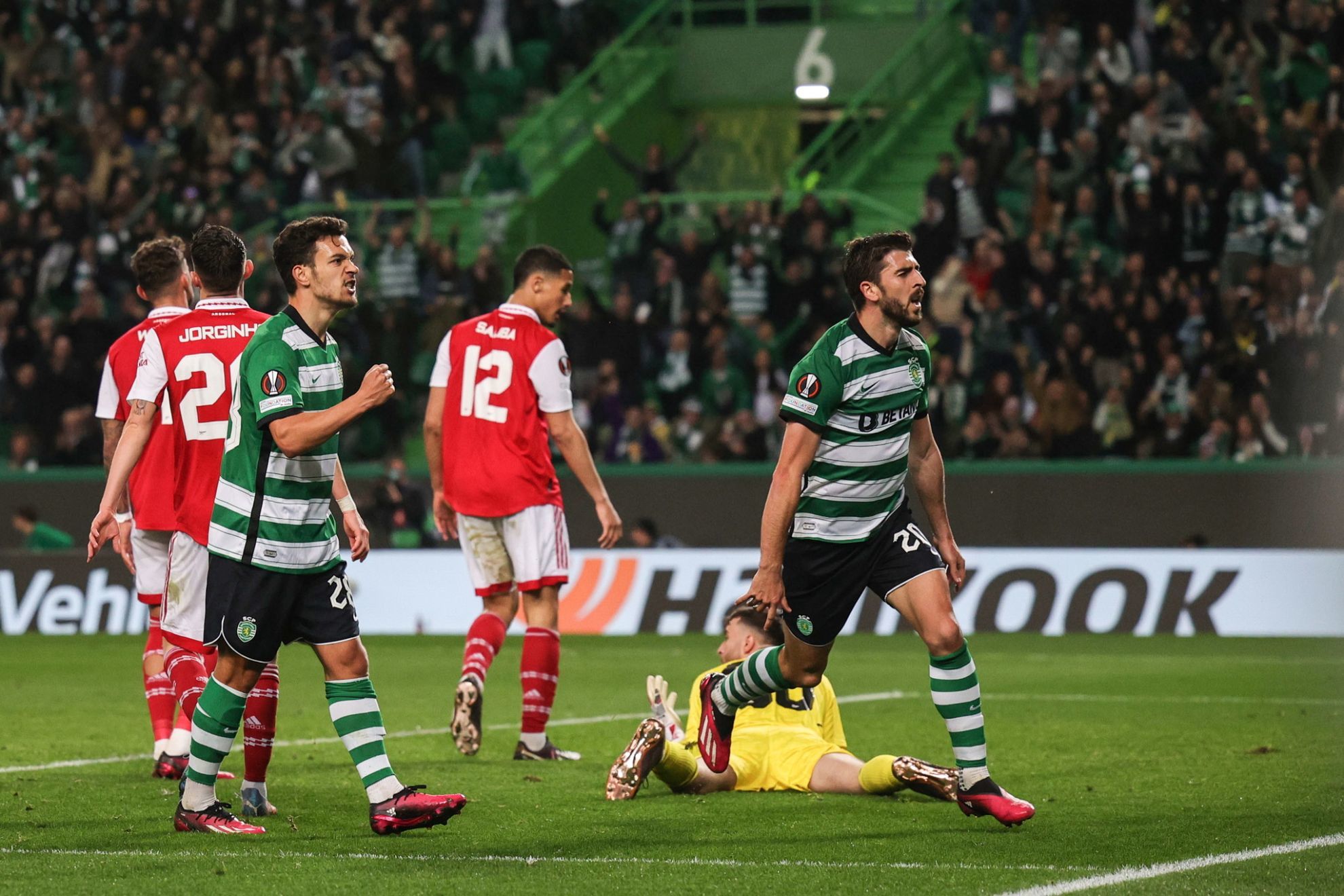 Sporting CP celebrate a goal against Arsenal