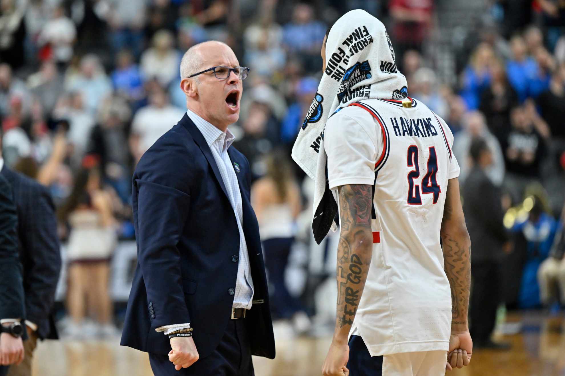 UConn head coach Dan Hurley reacts next to Jordan Hawkins (24) after the 88-65 win against Arkansas of a Sweet 16 college basketball game in the West Regional of the NCAA Tournament.