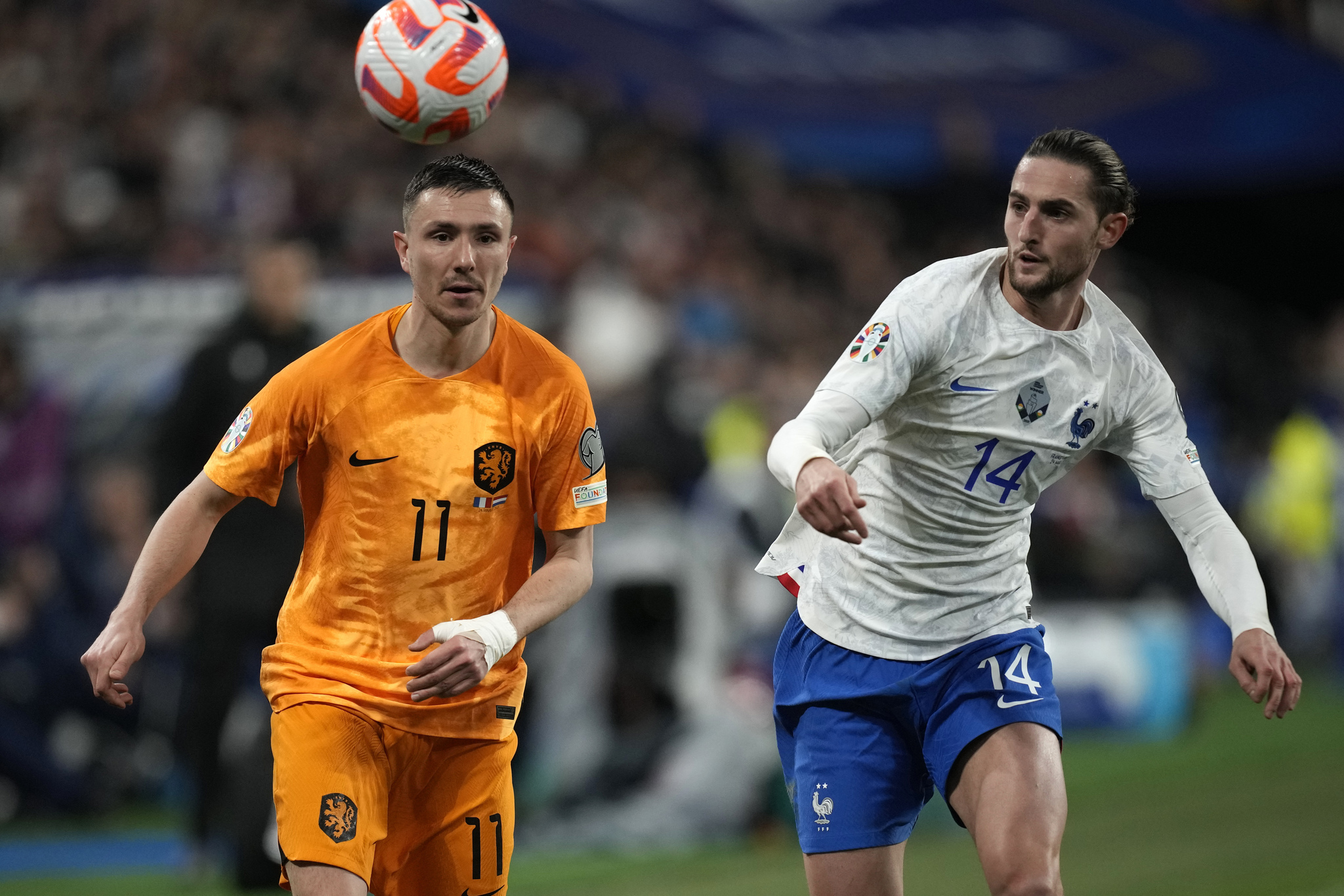 Netherlands' Steven Berghuis, left, challenges for the ball with  lt;HIT gt;France lt;/HIT gt;'s Adrien Rabiot during the Euro 2024 group B qualifying soccer match between  lt;HIT gt;France lt;/HIT gt; and the Netherlands at the Stade de  lt;HIT gt;France lt;/HIT gt; in Saint Denis, outside Paris,  lt;HIT gt;France lt;/HIT gt;, Friday, March 24, 2023. (AP Photo/Christophe Ena)