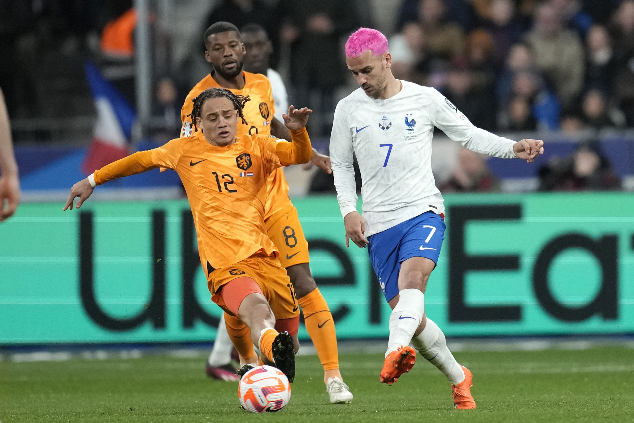  lt;HIT gt;France lt;/HIT gt;'s Antoine Griezmann, right, challenges for the ball with Netherlands' Xavi Simons during the Euro 2024 group B qualifying soccer match between  lt;HIT gt;France lt;/HIT gt; and the Netherlands at the Stade de  lt;HIT gt;France lt;/HIT gt; in Saint Denis, outside Paris,  lt;HIT gt;France lt;/HIT gt;, Friday, March 24, 2023. (AP Photo/Christophe Ena)