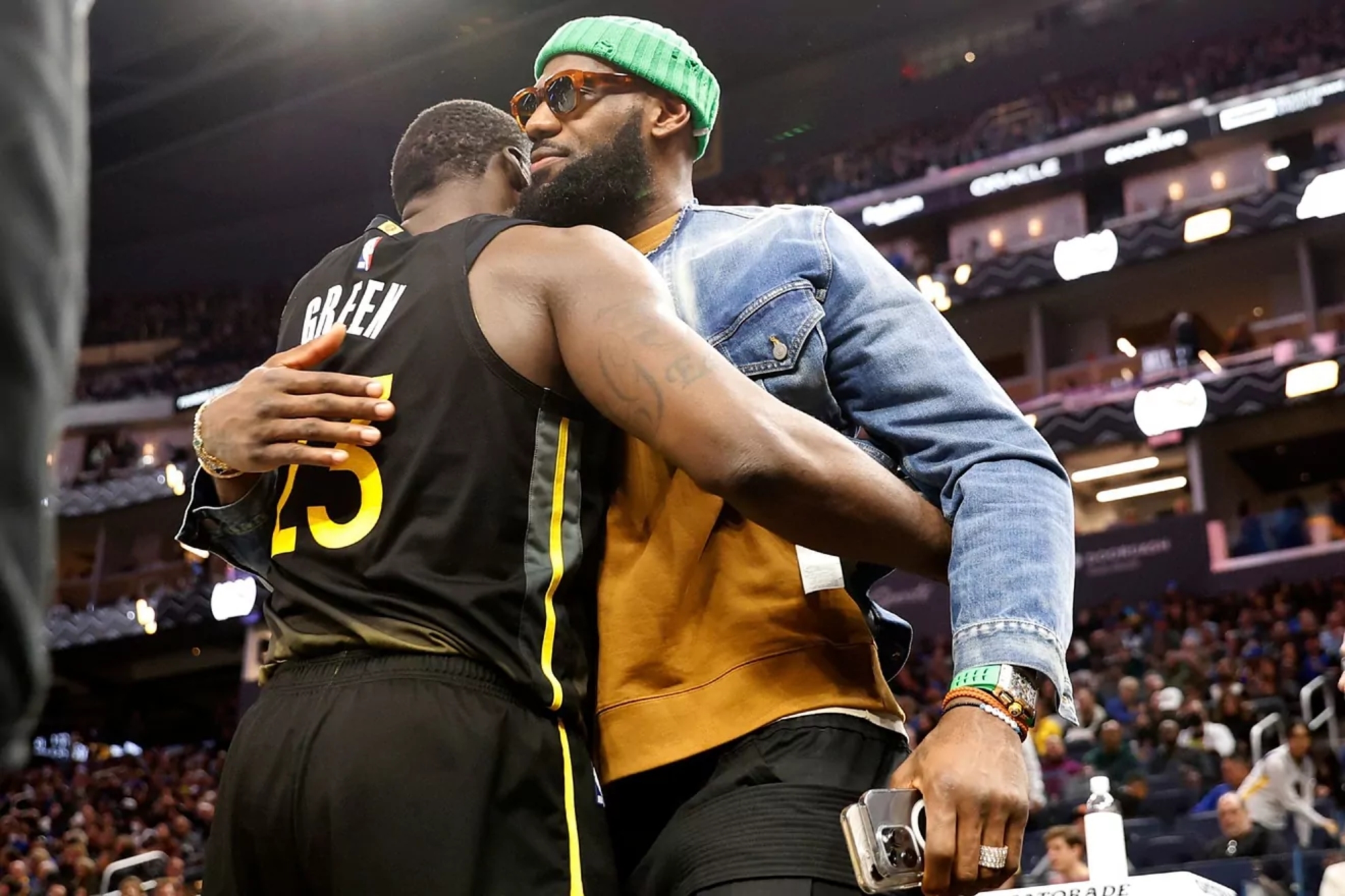 Draymond Green and LeBron James greeting each other.