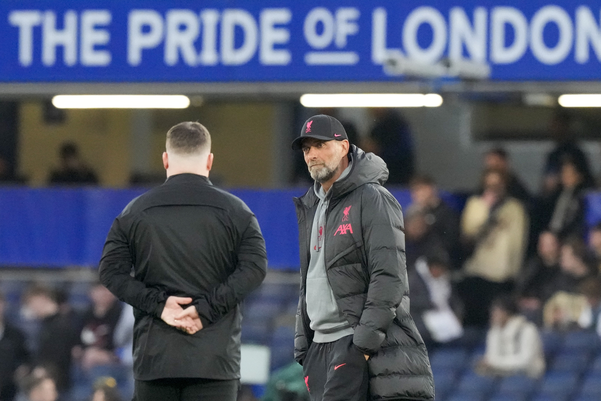 Liverpool's manager Jurgen Klopp, right, speaks with an assisstant before the English Premier League soccer match between  lt;HIT gt;Chelsea lt;/HIT gt; and Liverpool at Stamford Bridge stadium in London, Tuesday, April 4, 2023. (AP Photo/Frank Augstein)