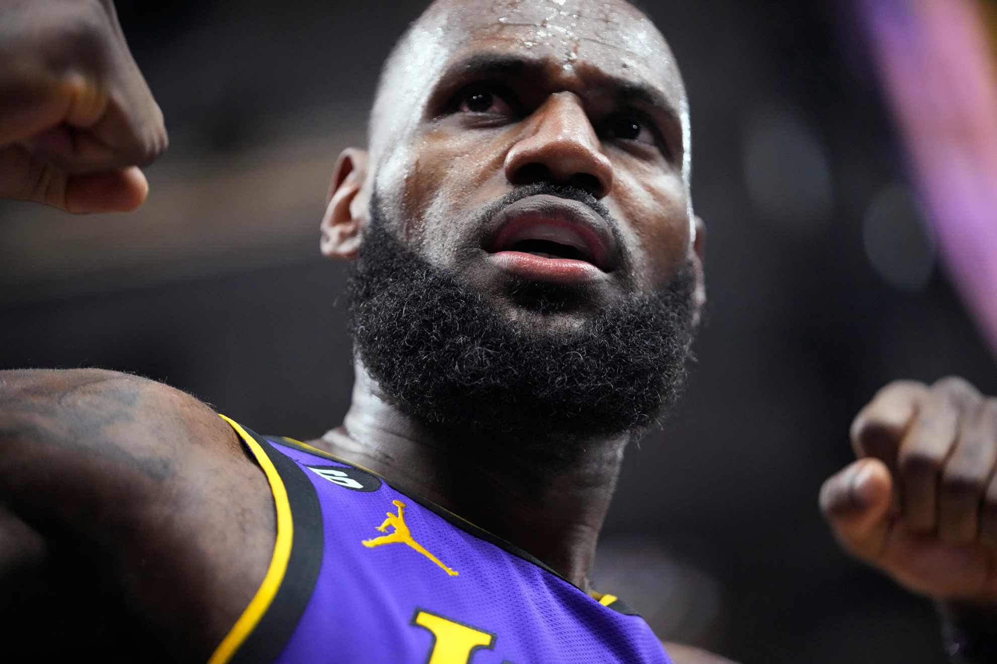 Los Angeles Lakers forward LeBron James reacts after scoring against the Utah Jazz during the first half of an NBA basketball game Tuesday, April 4, 2023, in Salt Lake City.