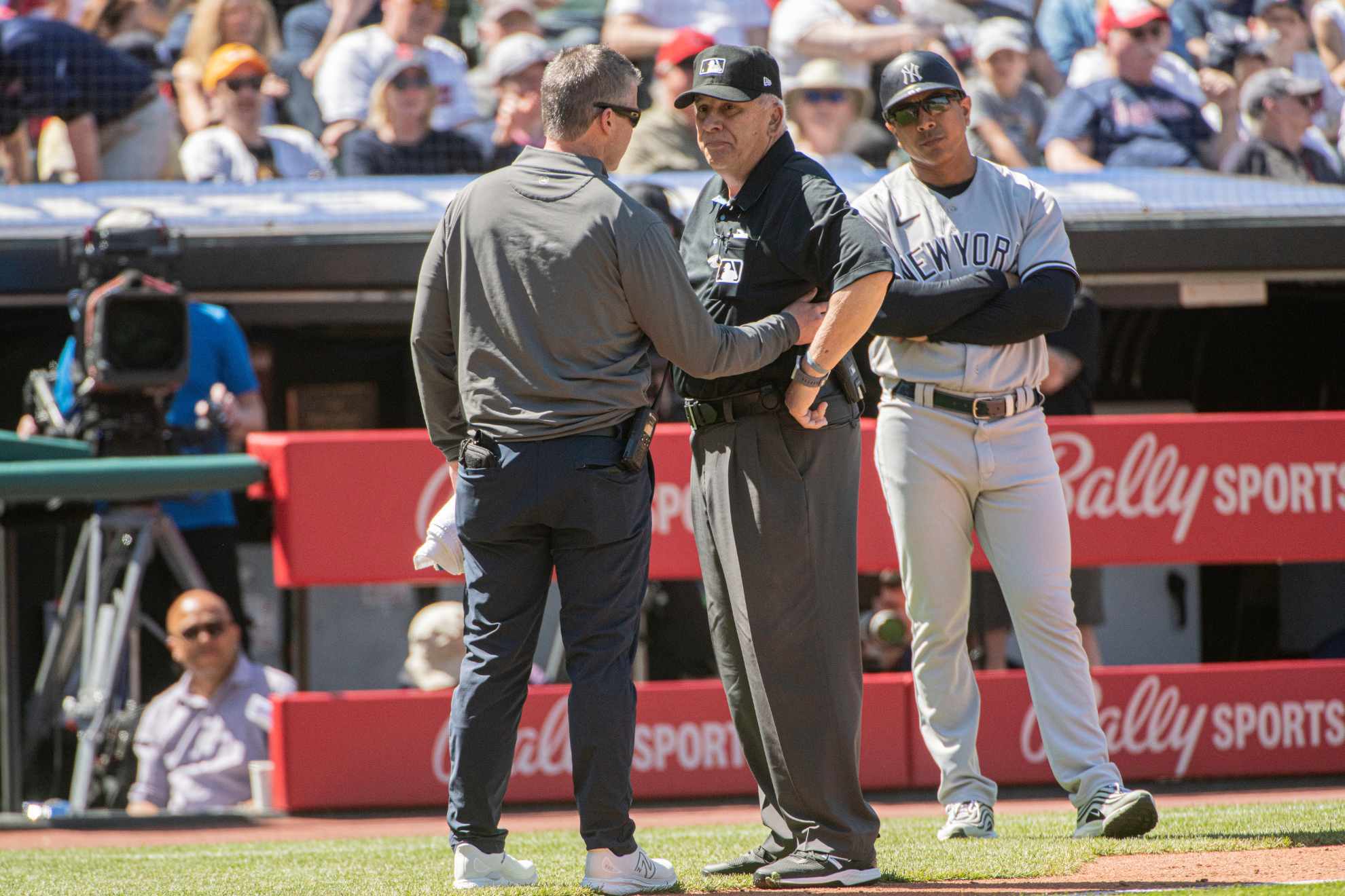 Vanover, who had ejected Yankees manager Aaron Boone in the first inning following a controversial play, was knocked off his feet by the throw.