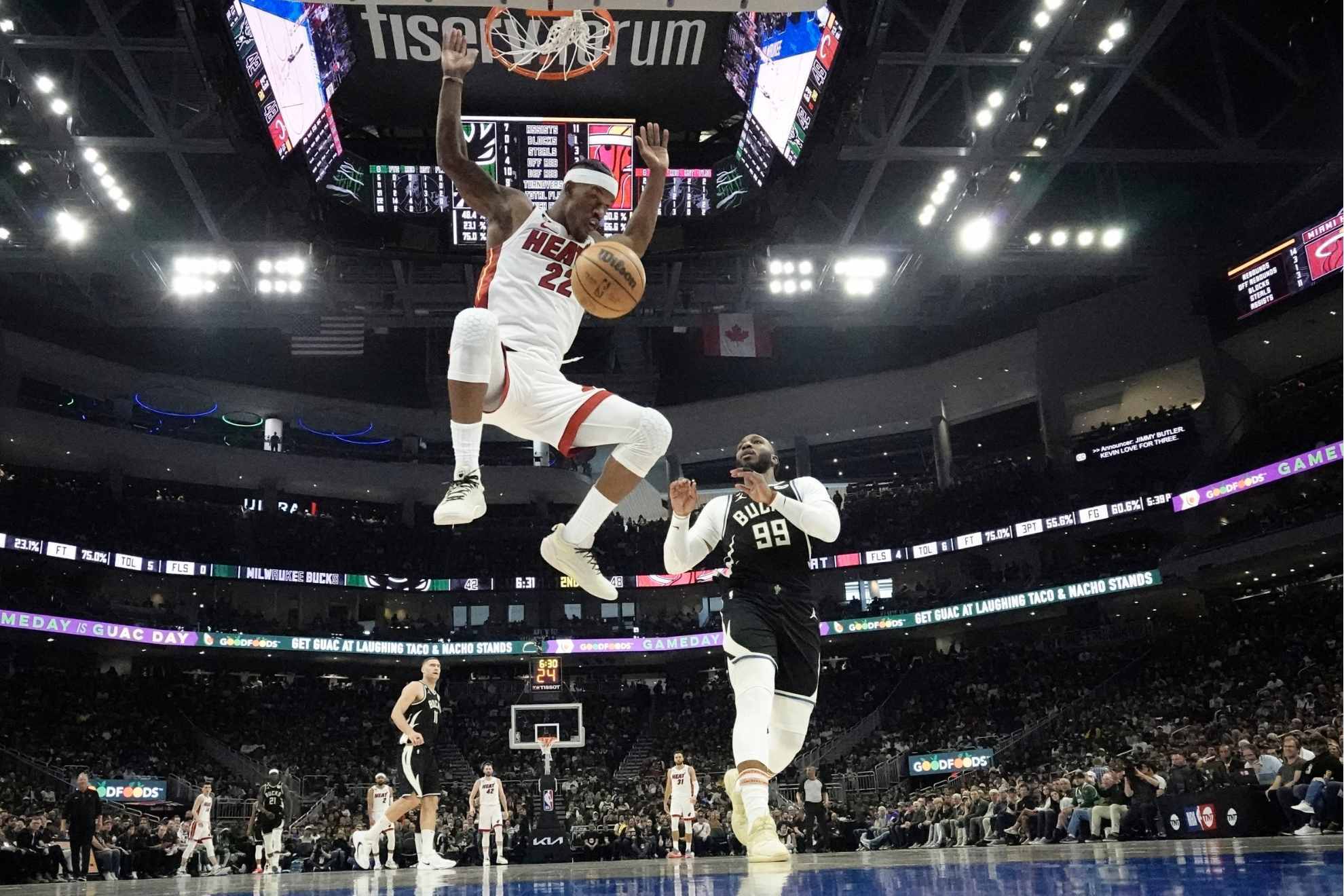 Jimmy Butler dunks in the Miami Heat's playoff win in Milwaukee.