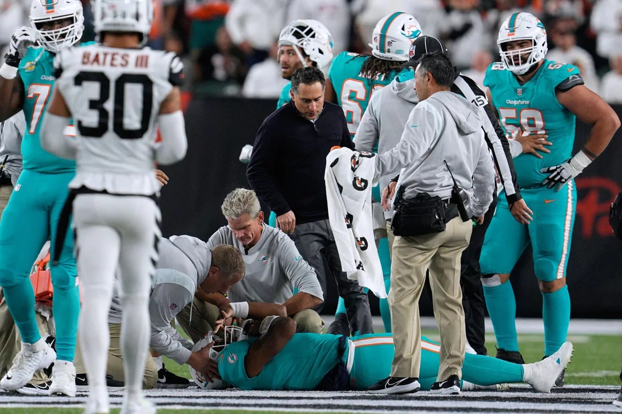 Miami Dolphins doctors check on Tua Tagovailoa after suffering a concussion.