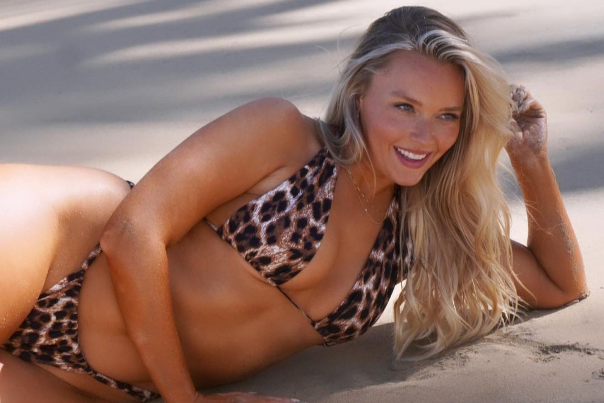 Camille Kostek in a swimsuit photoshoot for SI.