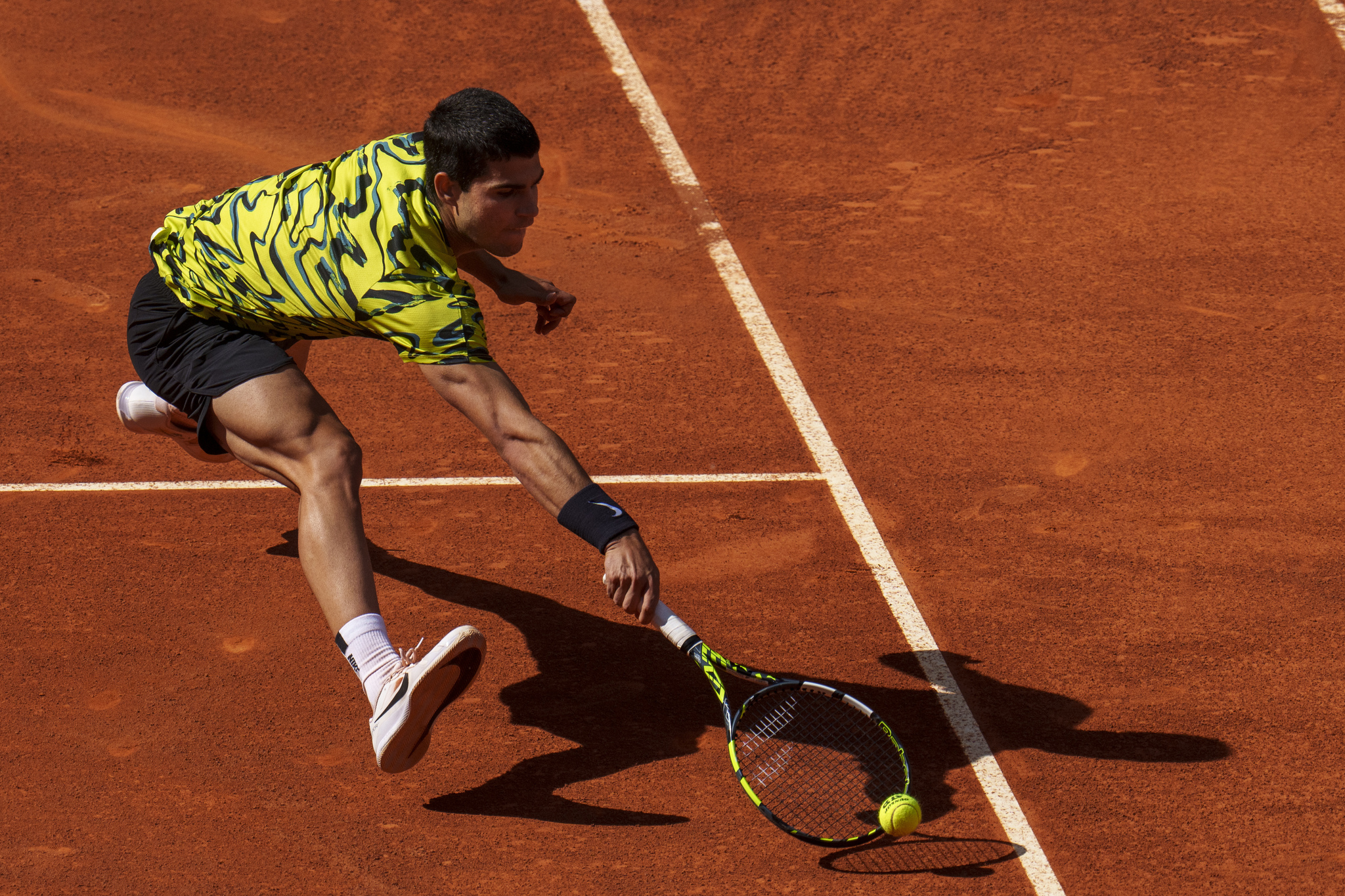 Carlos lt;HIT gt;Alcaraz lt;/HIT gt; of Spain returns the ball against Russia's Karen Kachanov during their match at the Madrid Open tennis tournament in Madrid, Spain, Wednesday, May 3, 2023. (AP Photo/Manu Fernandez)
