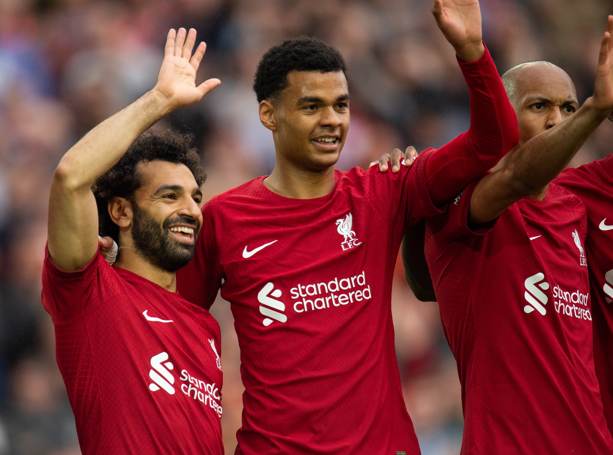 Liverpools Mohamed Salah (L) celebrates with his teammate Cody Gapko (R)