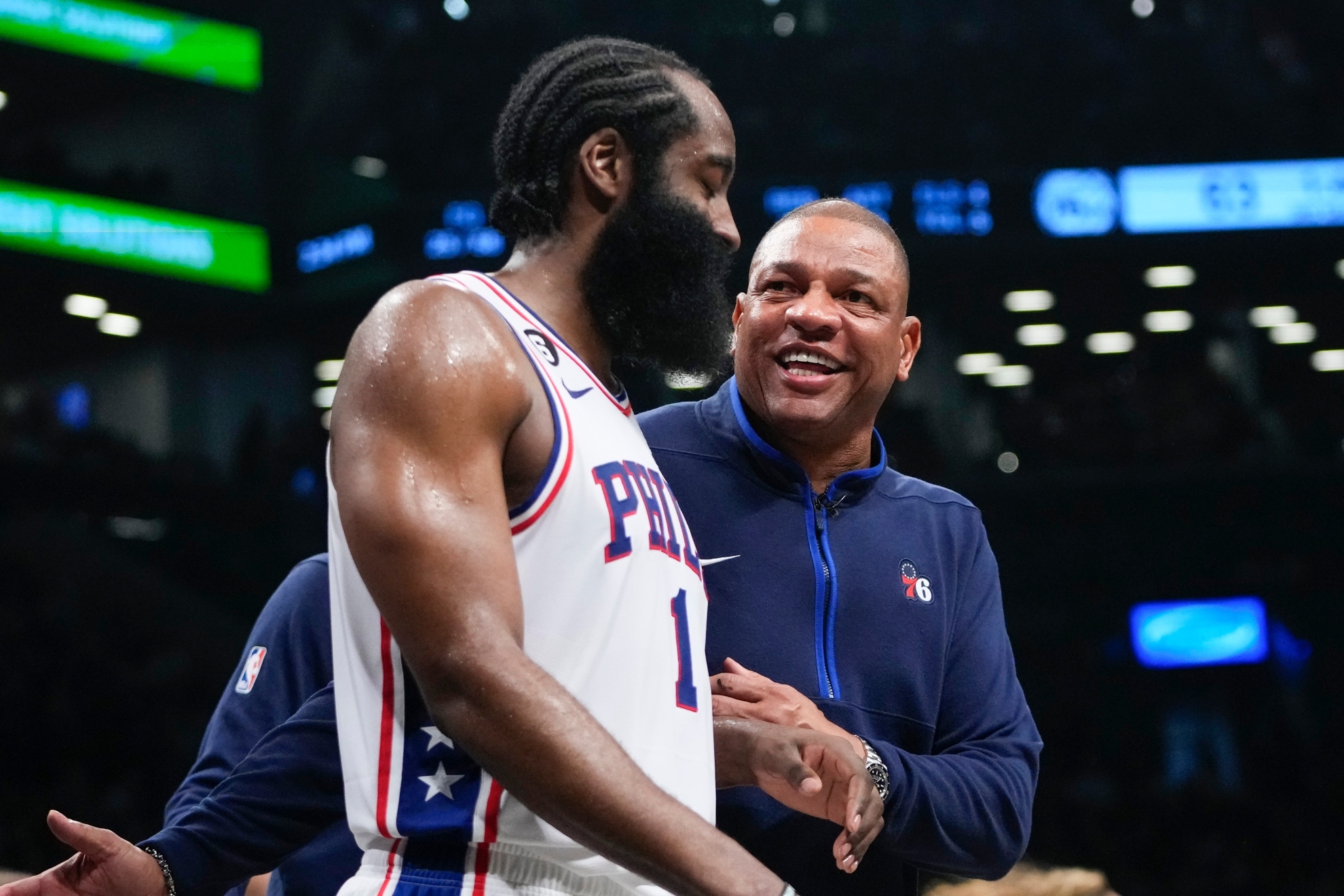 Image of James Harden talking to Doc Rivers at a Sixers game.