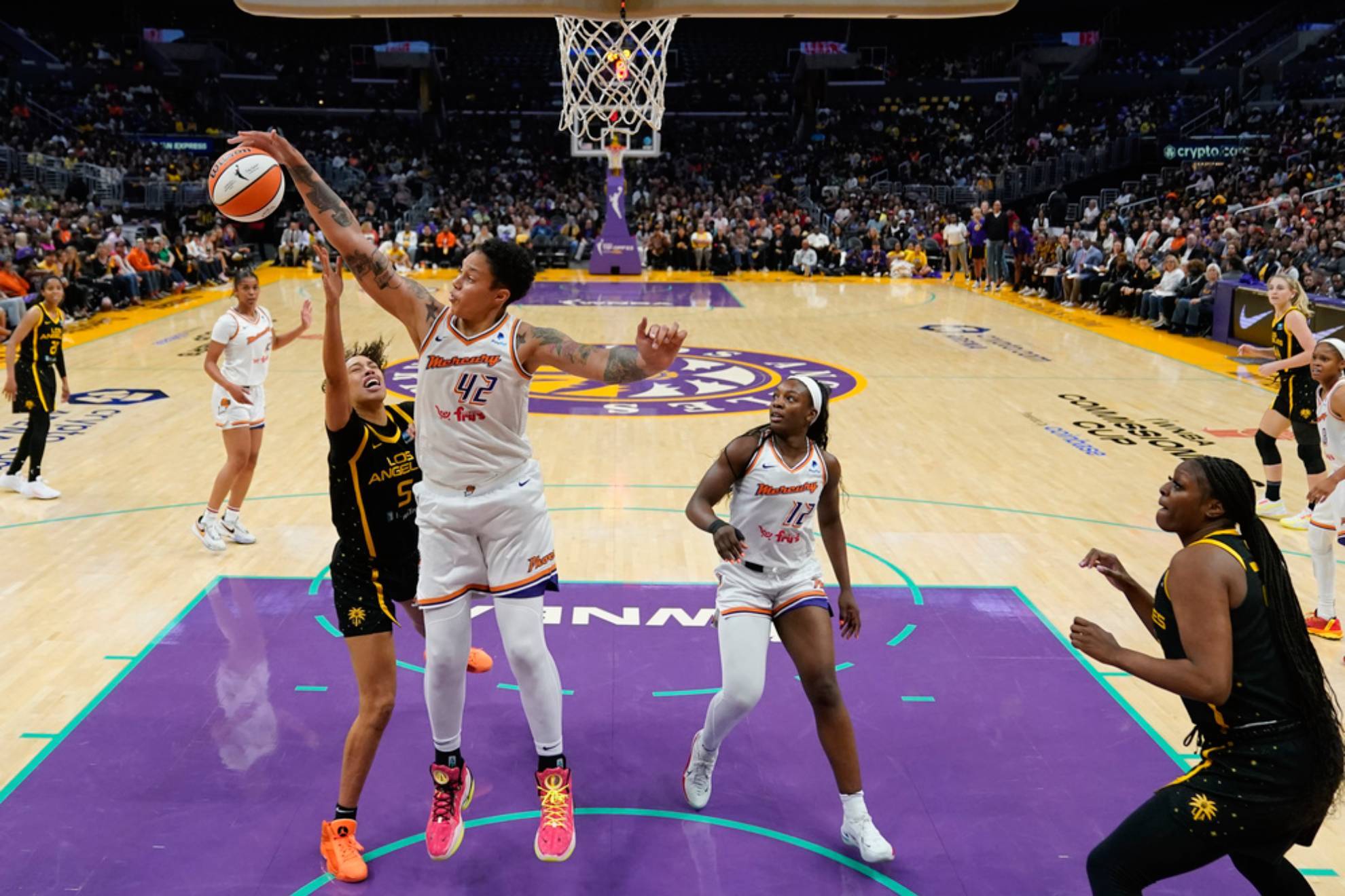 Phoenix Mercury center Brittney Griner (42) blocks a shot by Los Angeles Sparks guard Dearica Hamby (5) during the second half of a WNBA basketball game in Los Angeles, Friday, May 19, 2023.