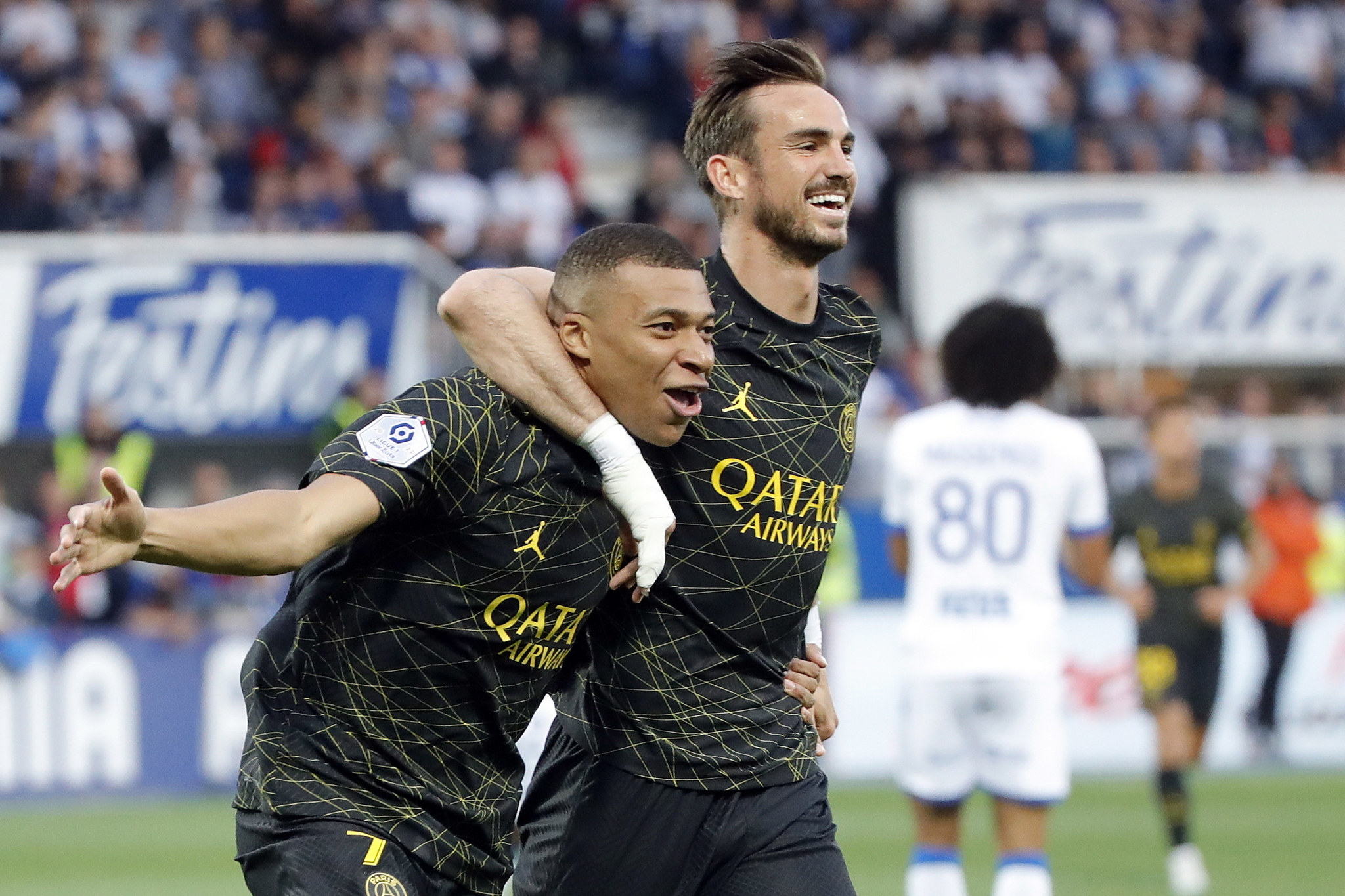 Paris Saint Germain's Kylian Mbappe (L) celebrates with Fabian Ruiz (R)